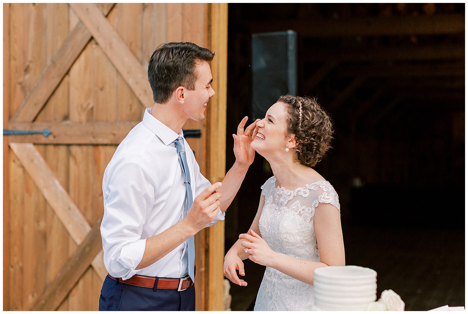 cake cutting at huge open barn the farmstead