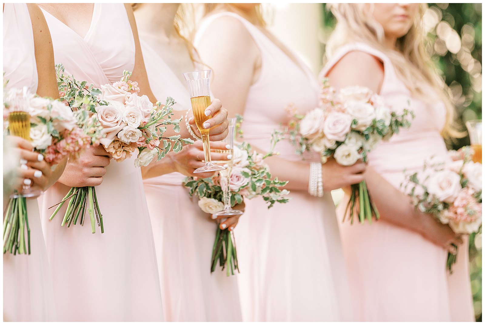 summer wedding toast outdoors at separk mansion with navy royal blue and soft pink bridal party