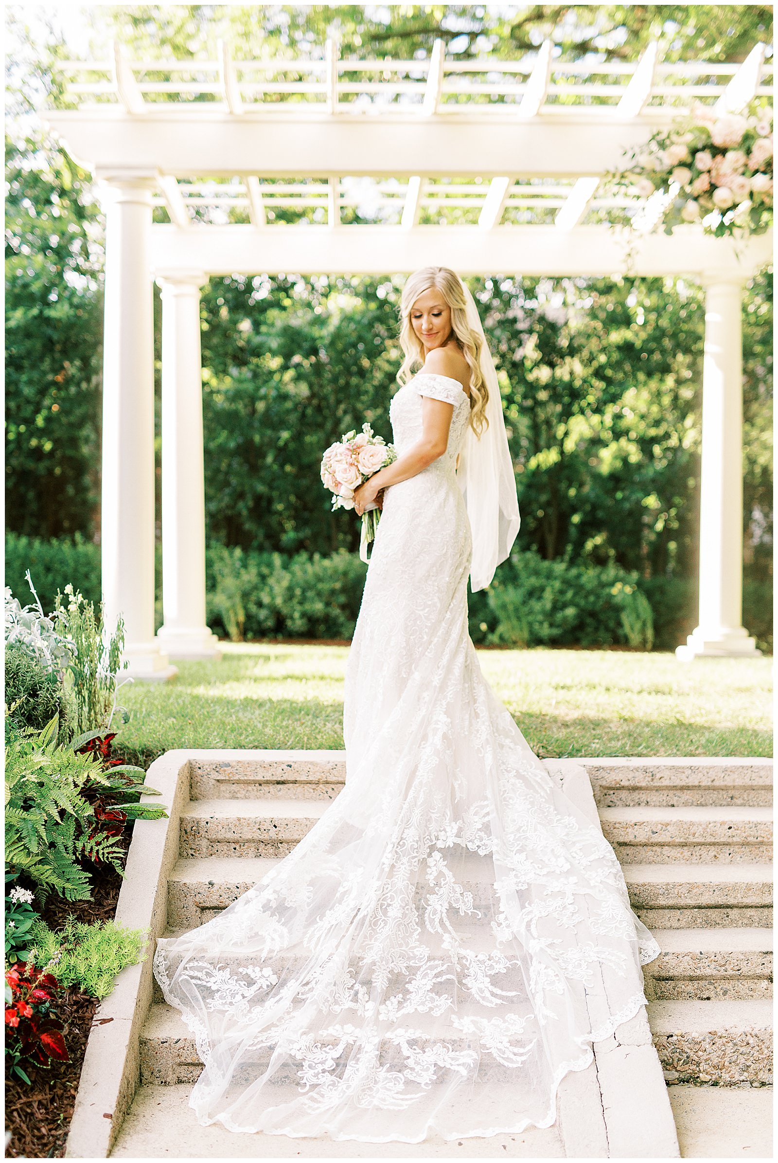 lace dress blond haired bride portraits outdoors under arch at separk mansion summer wedding