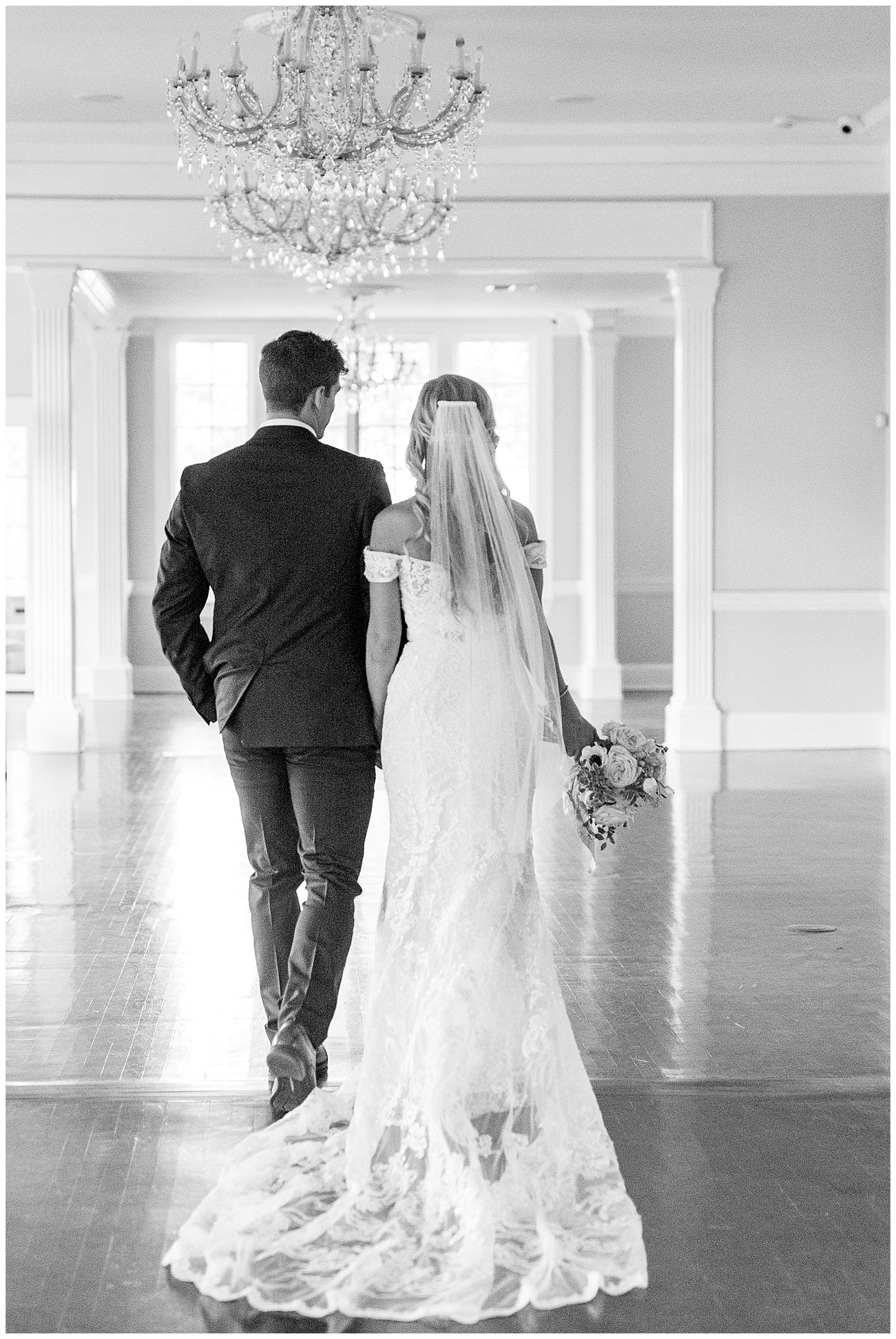 blond haired bride and dapper navy royal blue groom portraits in separk mansion black and white ballroom
