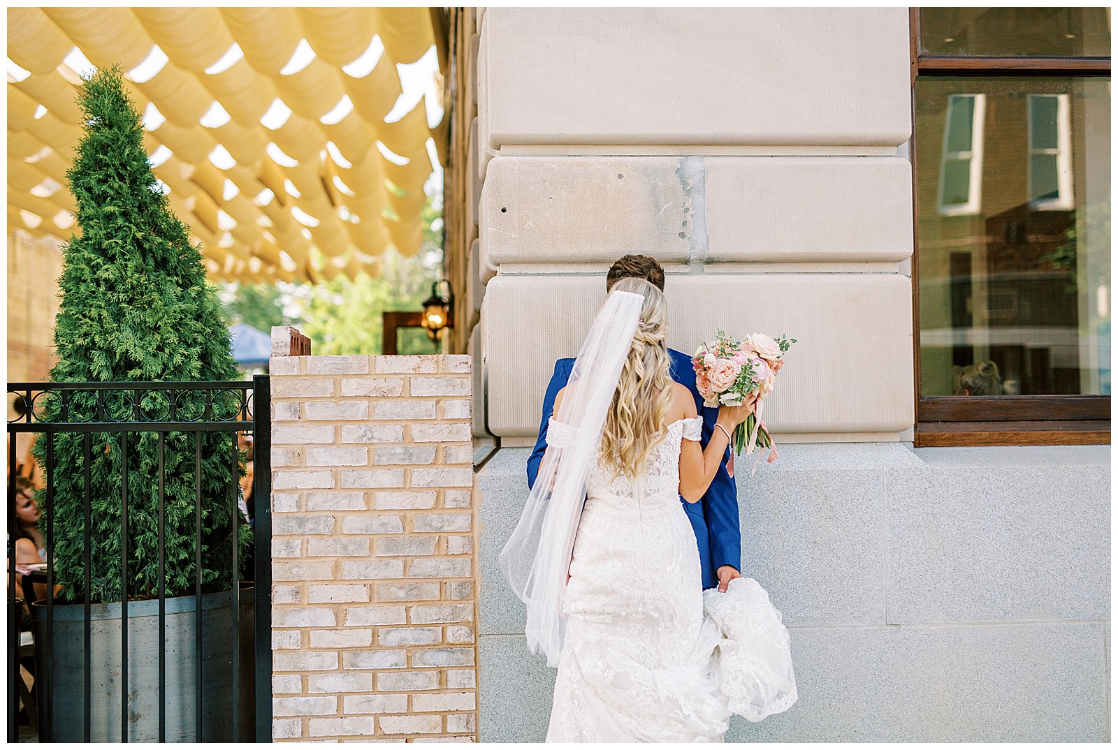 bride and groom outside esquire hotel outdoor patio wedding reception