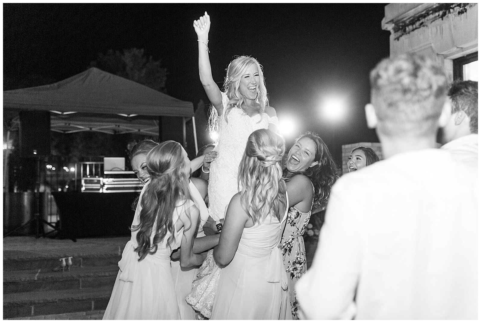 bride and groom crowd surf at esquire hotel outdoor patio wedding reception