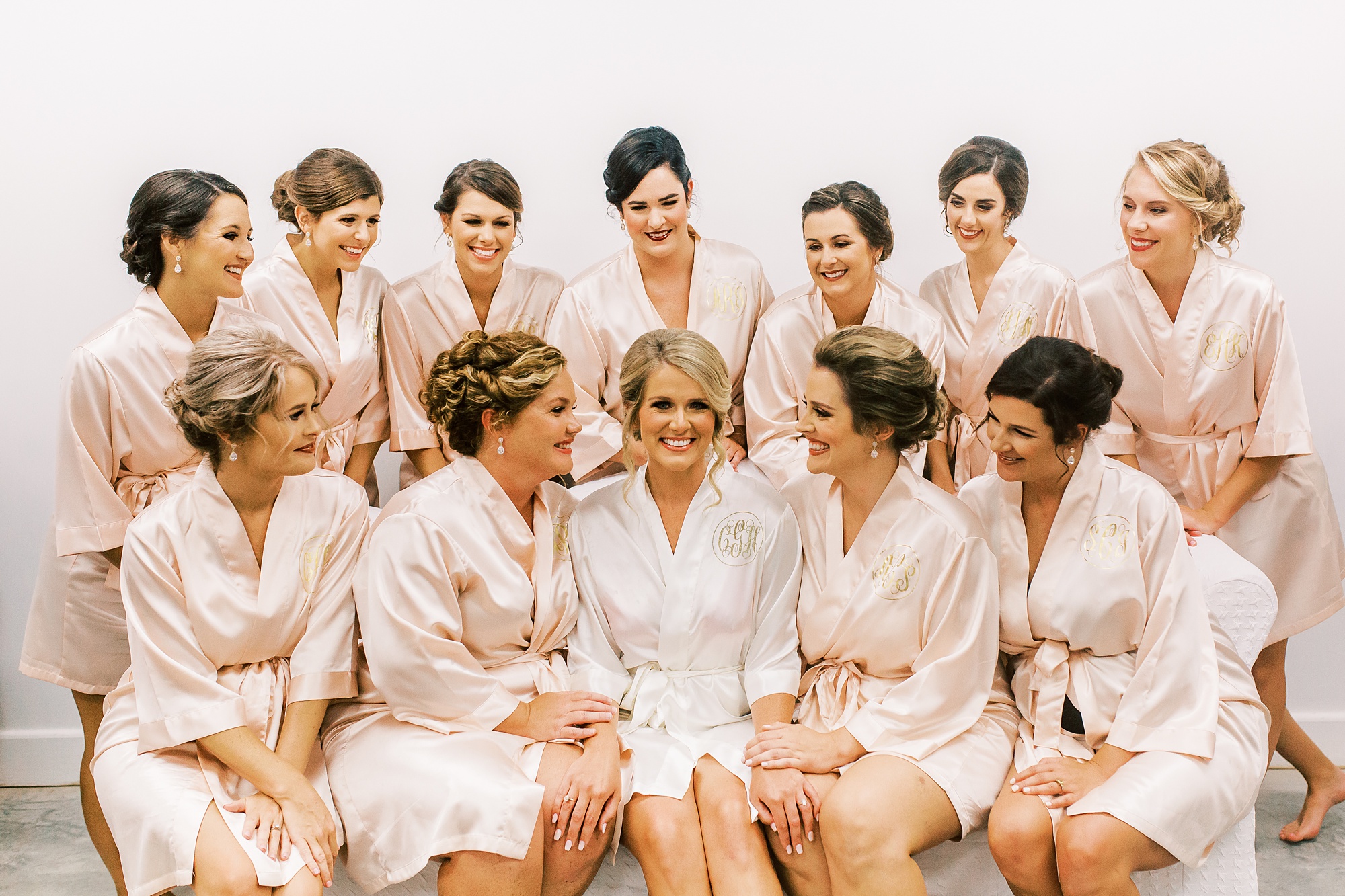 bridesmaids prepare with bridal on wedding morning