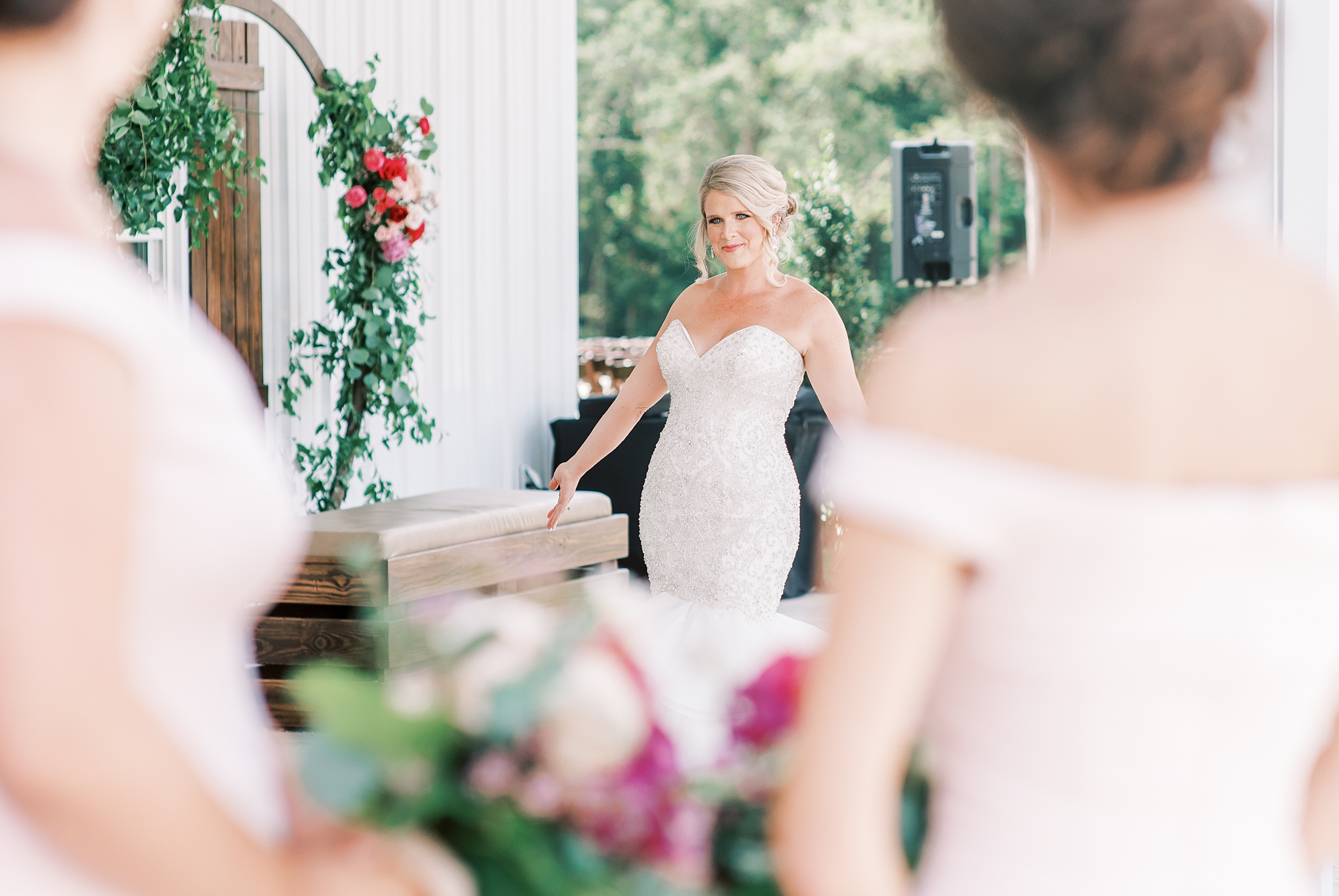 bride walks up to bridesmaids during reveal