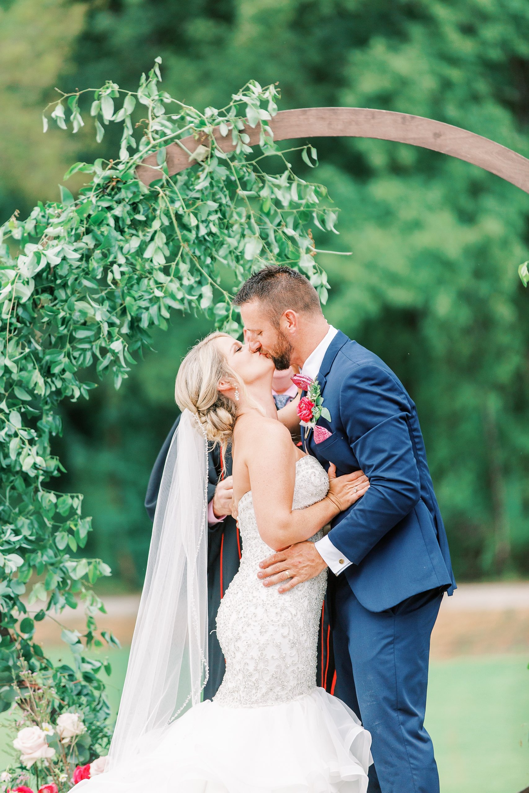 newlyweds kiss during Belle's Venue wedding ceremony
