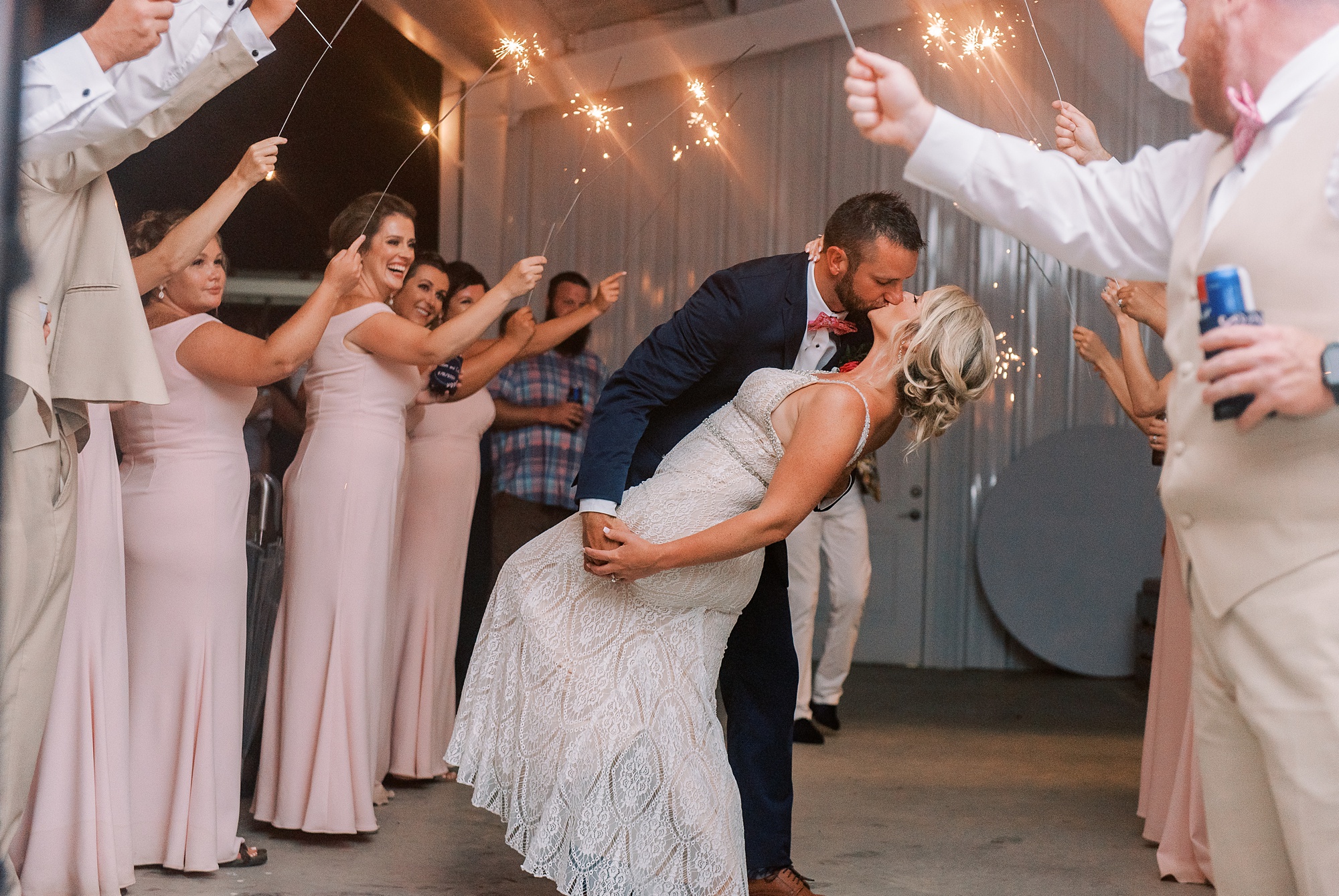 newlyweds kiss during sparkler exit at Belle's Venue