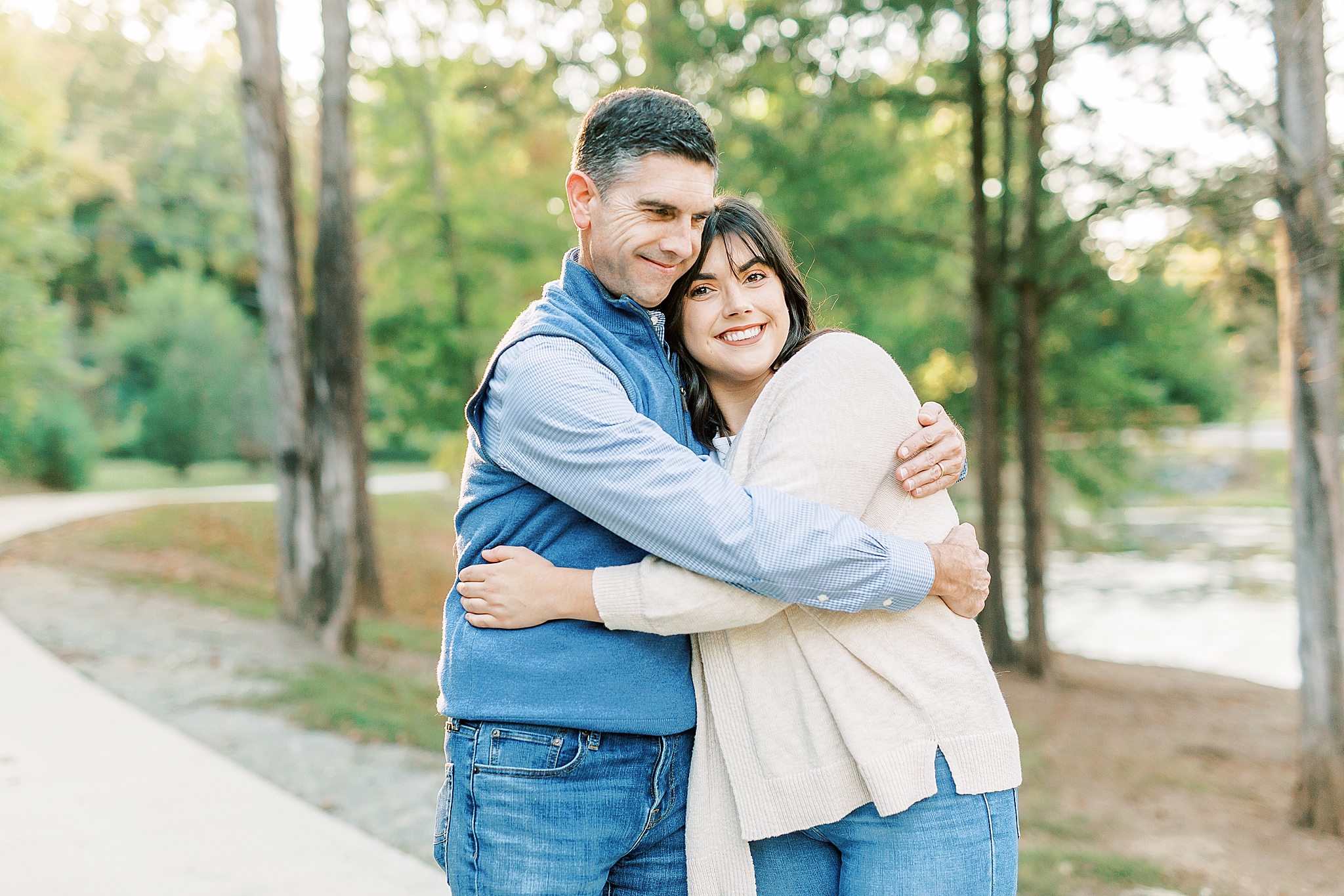 dad hugs daughter during Charlotte Fall Family Portraits