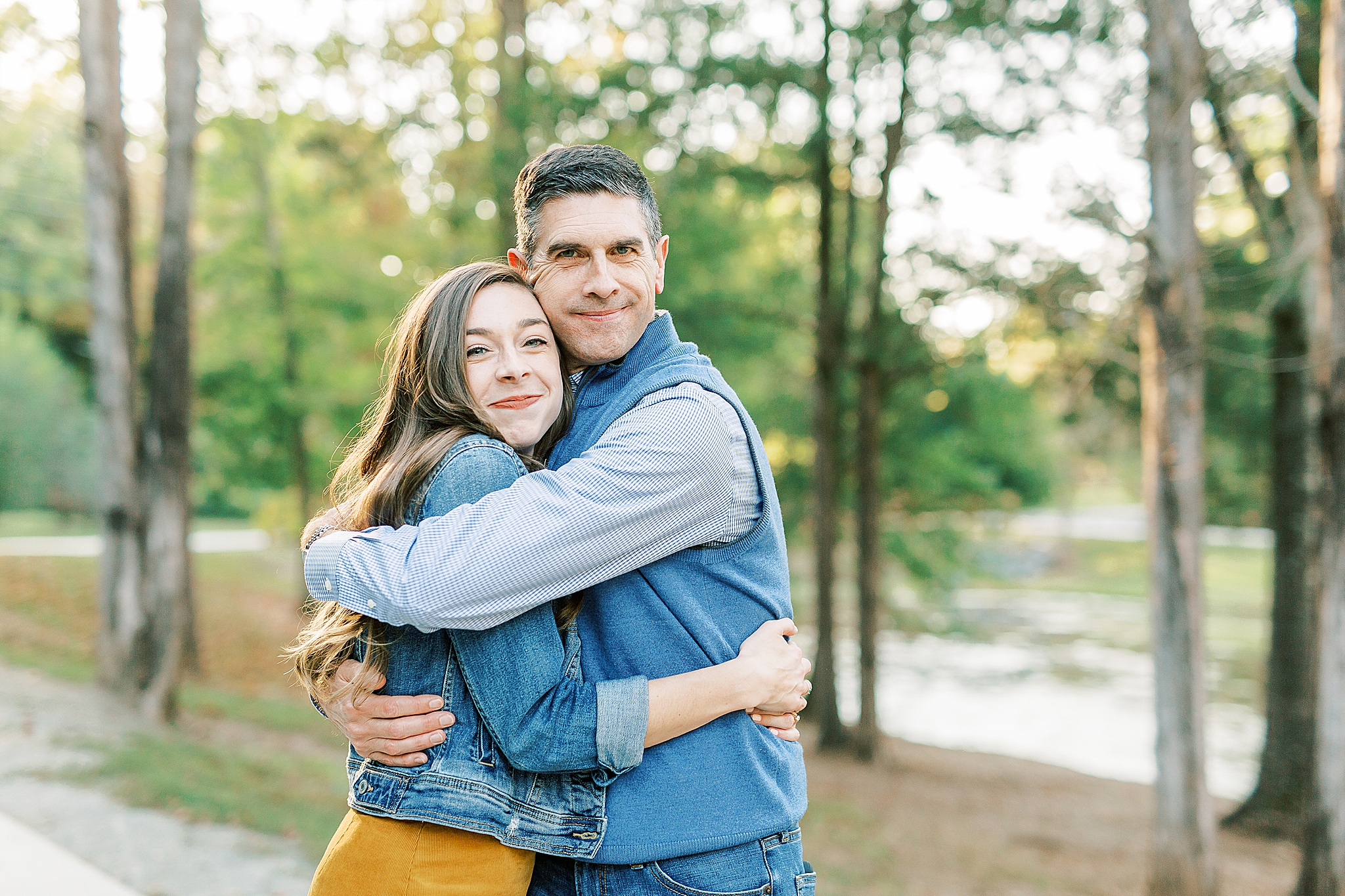 dad and daughter hug during NC family photos