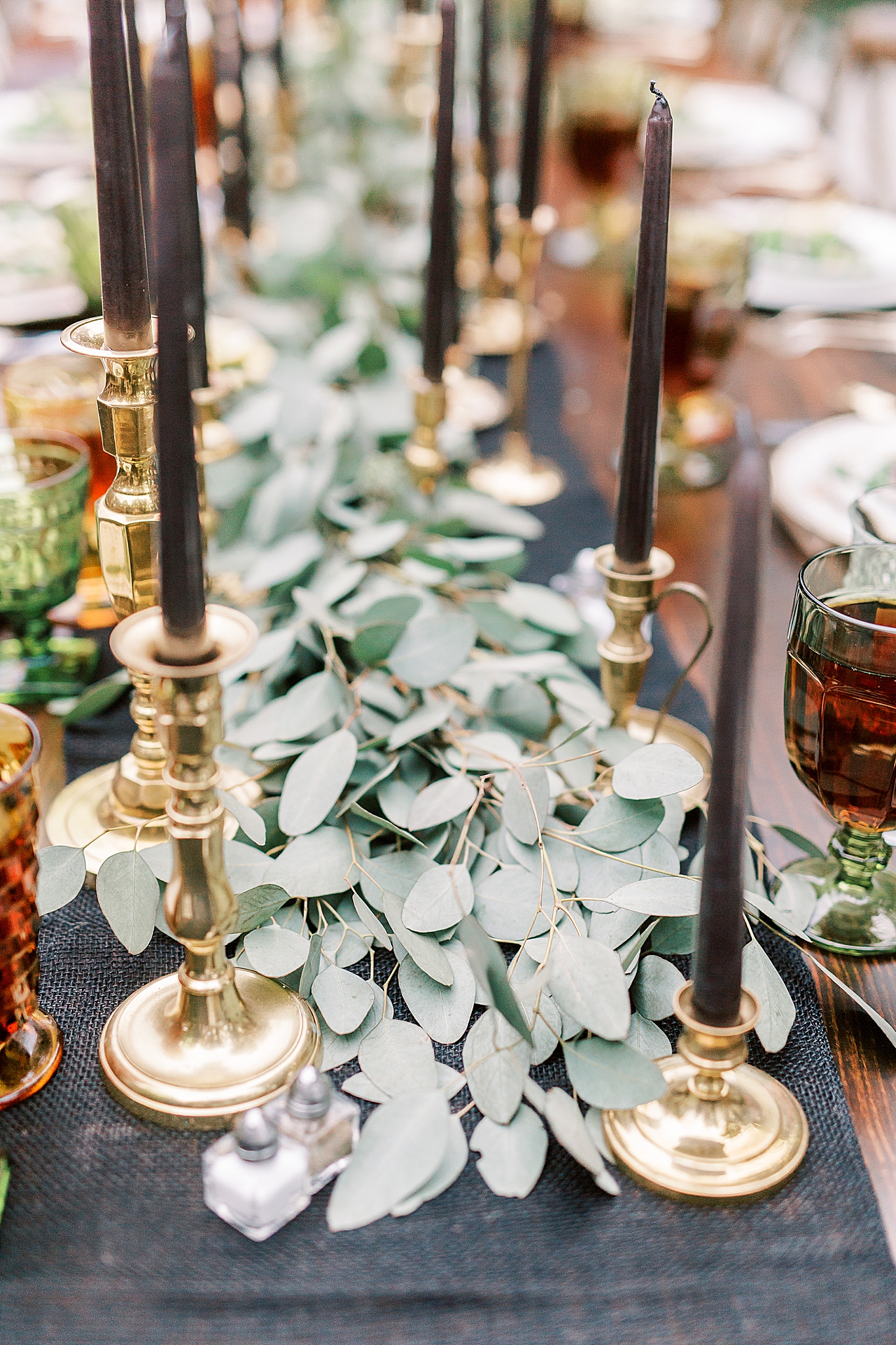 Charlotte NC Rehearsal Dinner with black candles and greenery