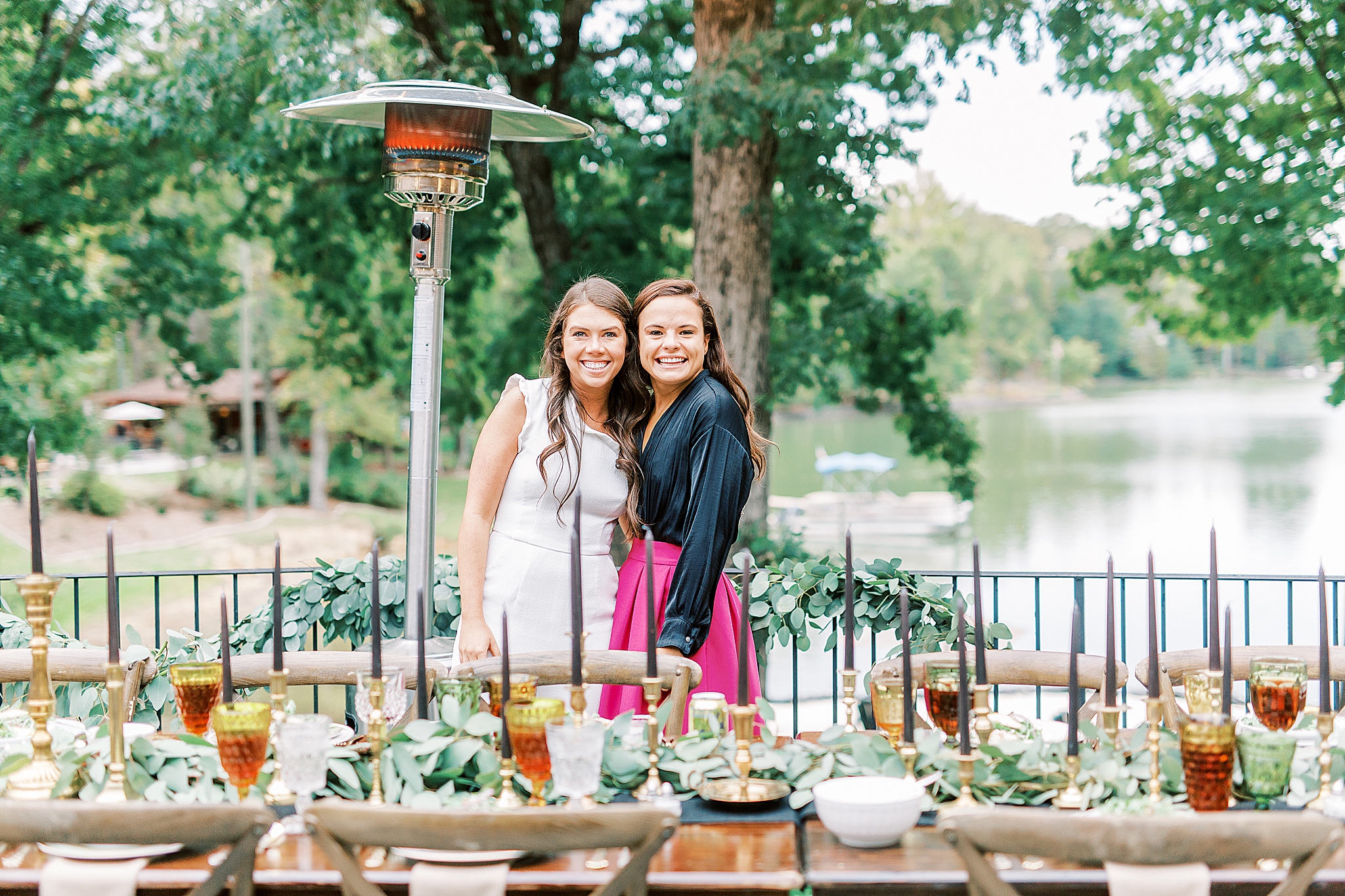 bride and maid of honor pose at Charlotte NC Rehearsal Dinner