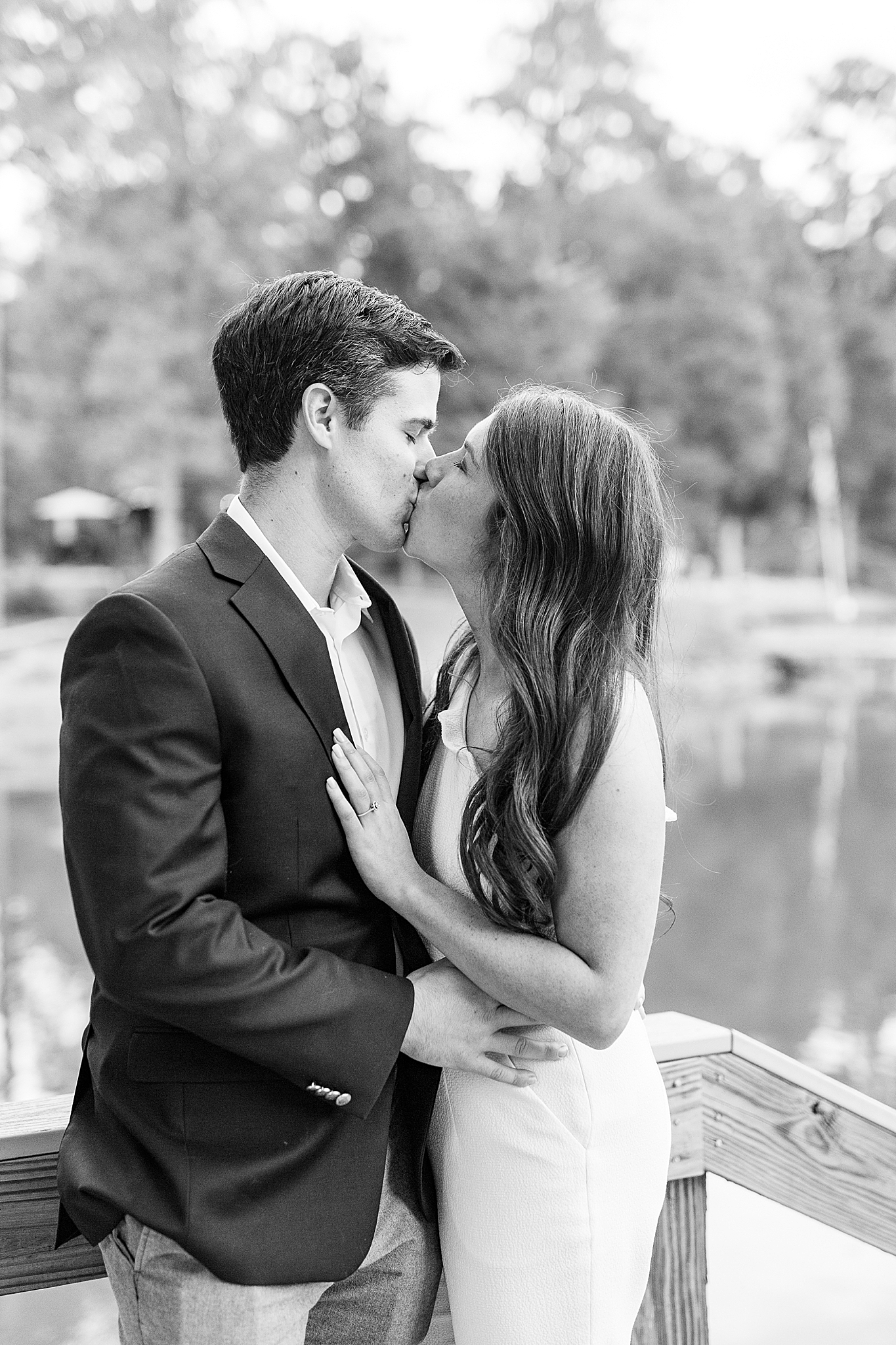 engaged couple kisses during welcome dinner