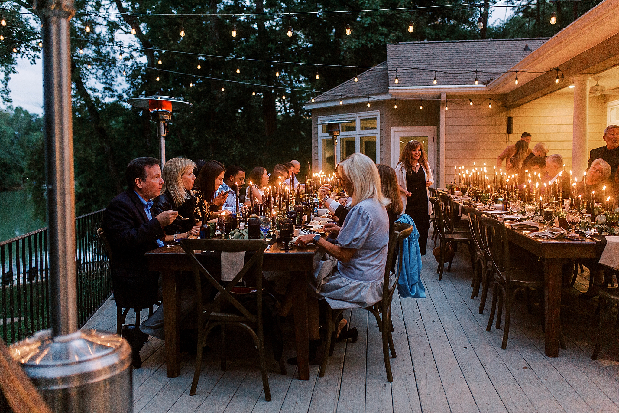 string lights above guests at Charlotte NC Rehearsal Dinner