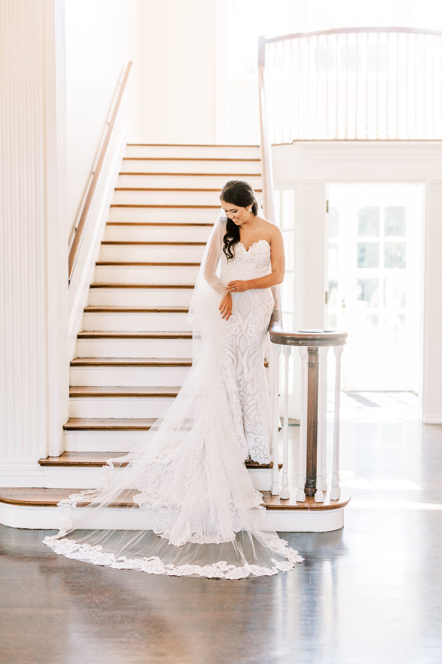bride poses on staircase at Separk Mansion