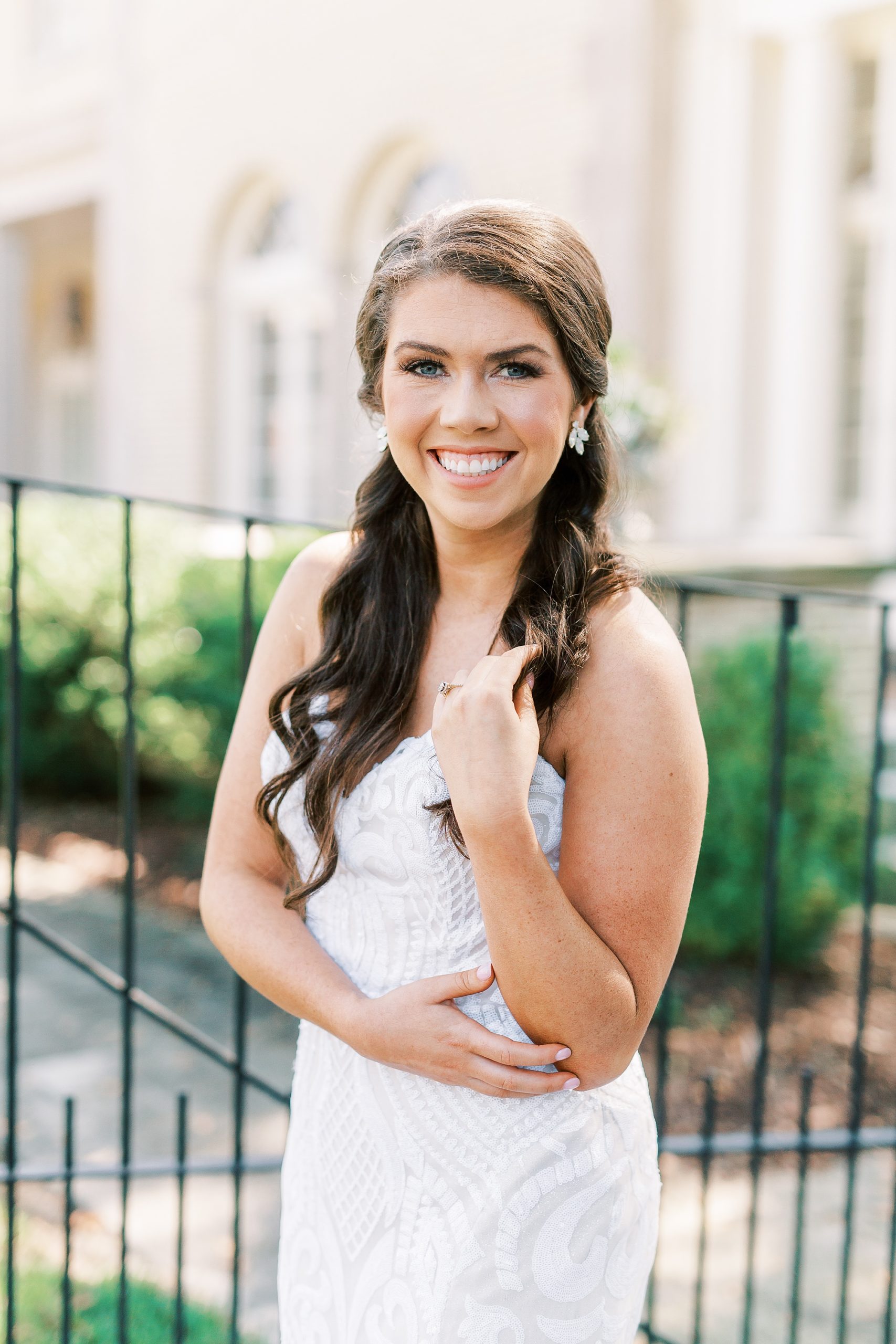 bride twirls hair during NC bridal session