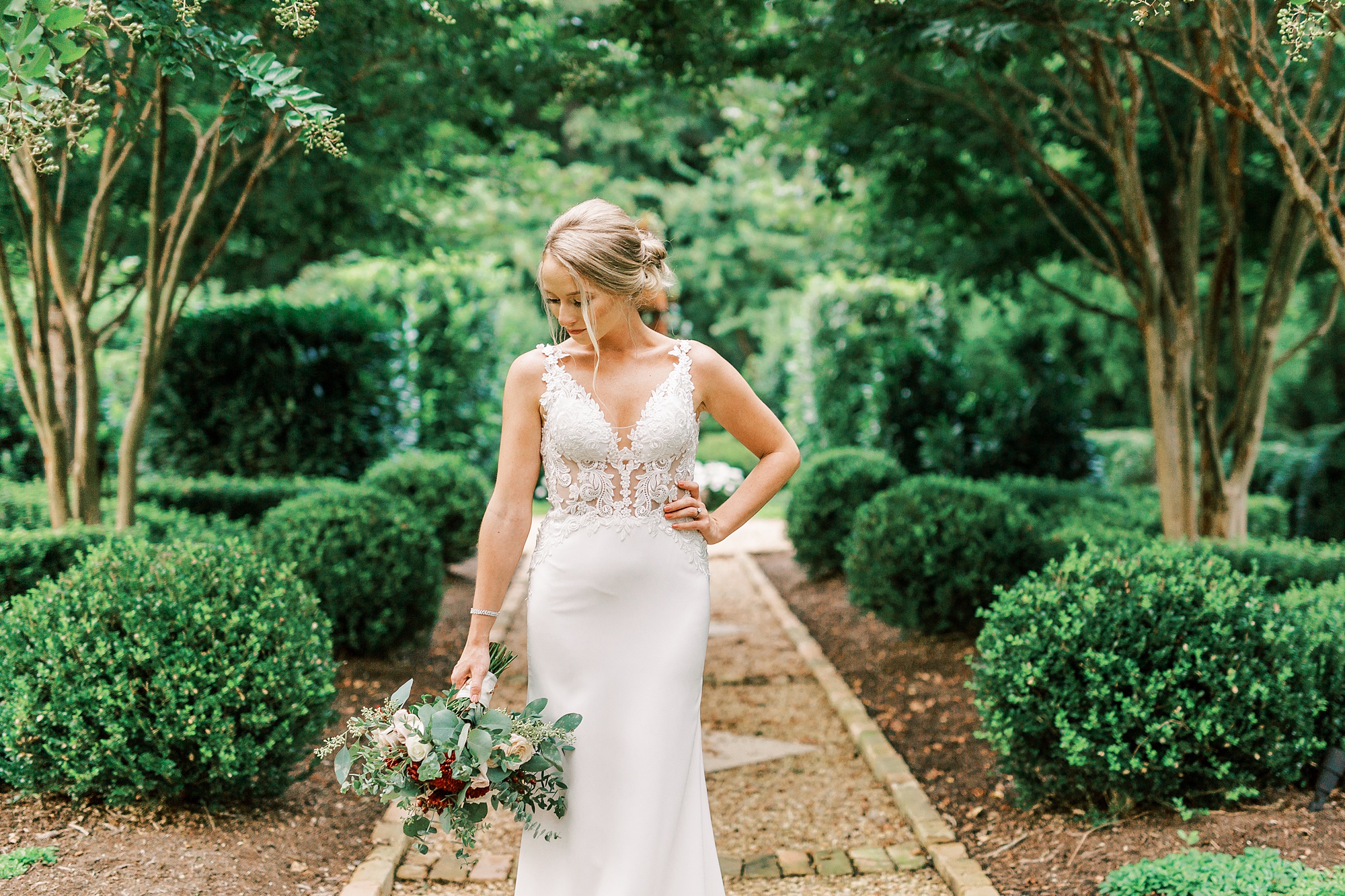 bride stands with hand on hip during bridal portraits at The Andrews Farm