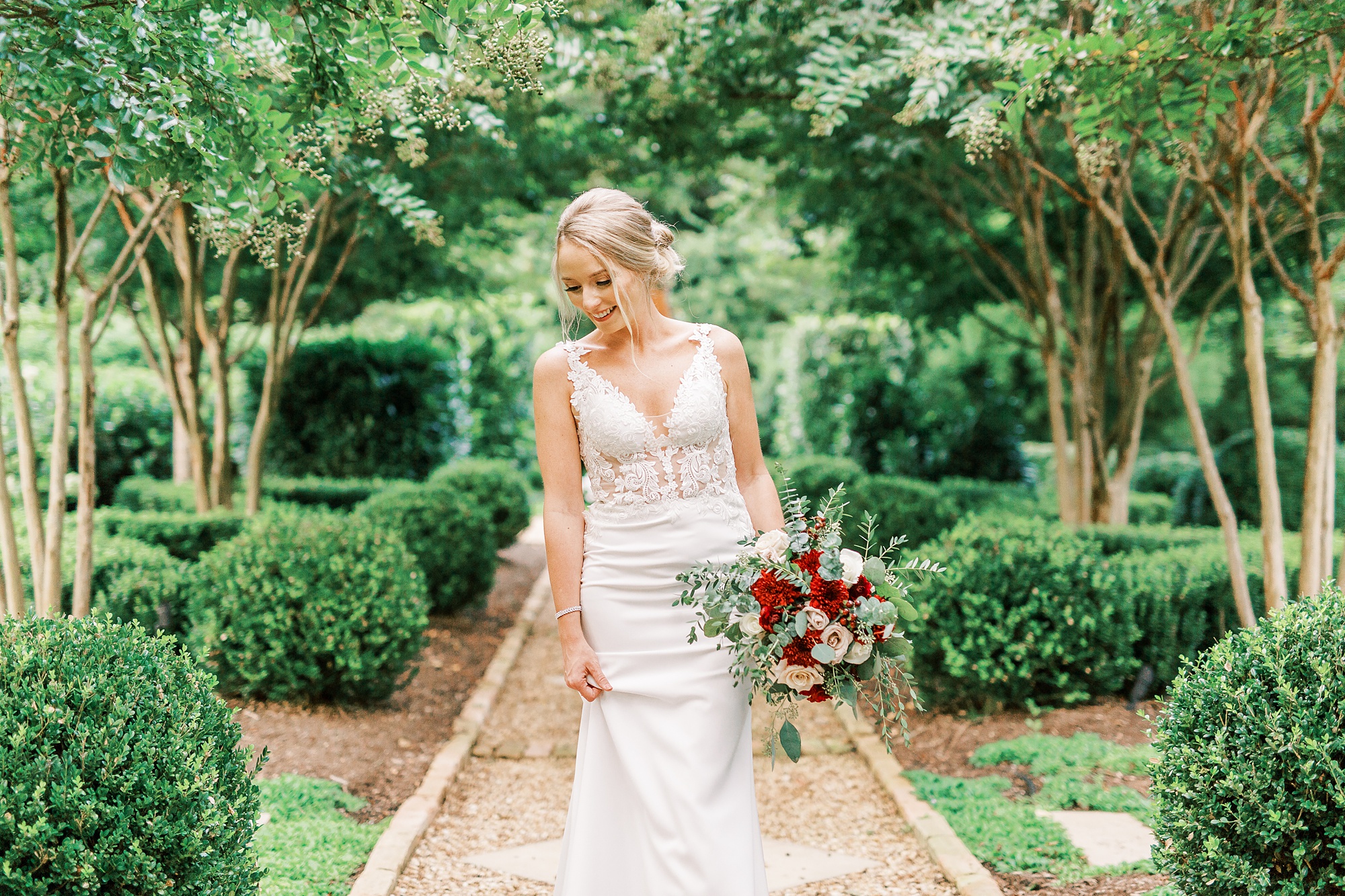 bride looks over shoulder wearing modern wedding dress with lace middle