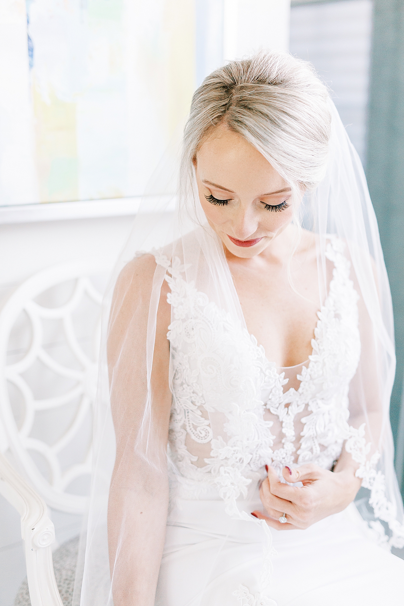 bride adjusts wedding dress before Andrews Farm elopement
