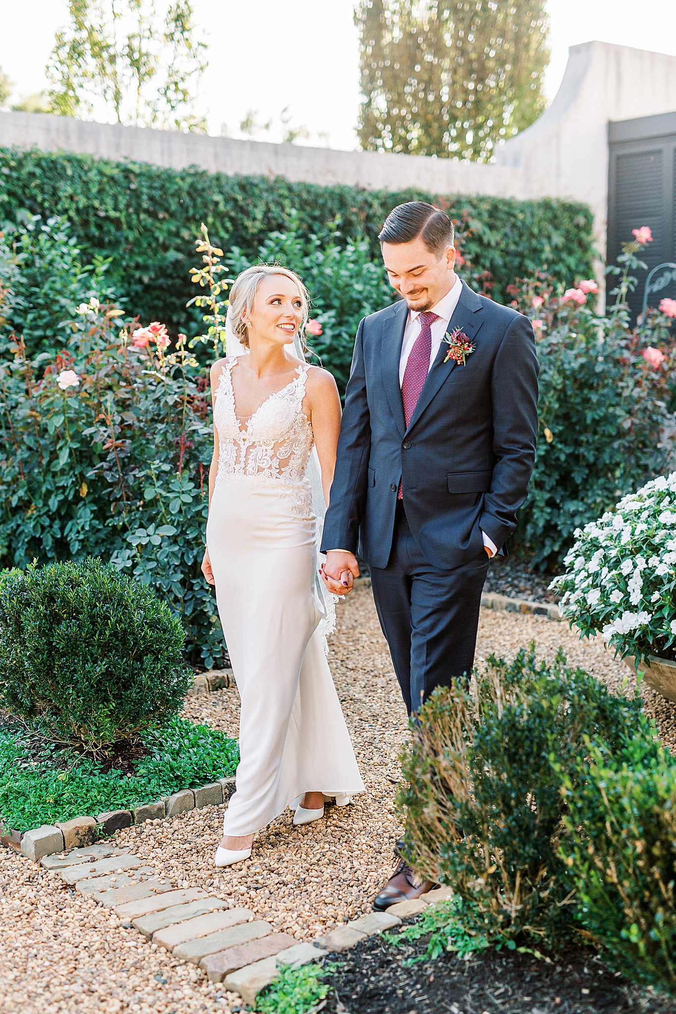 bride and groom walk through The Andrews Farm