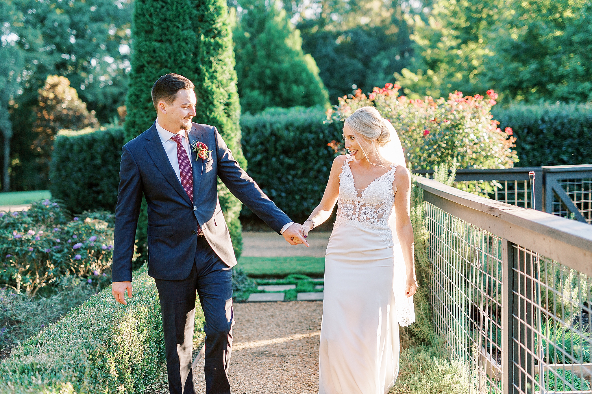 bride and groom walk through garden at The Andrews Farm