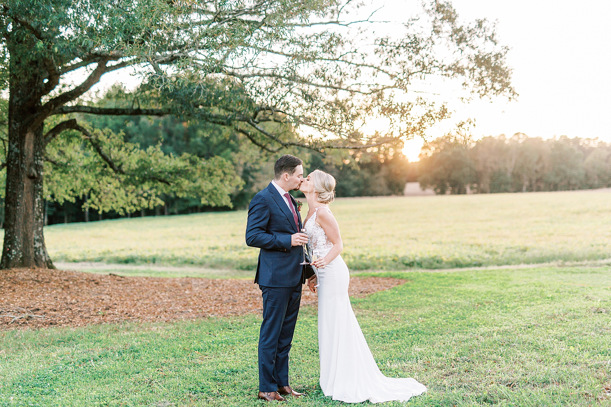 newlyweds kiss during champagne toast