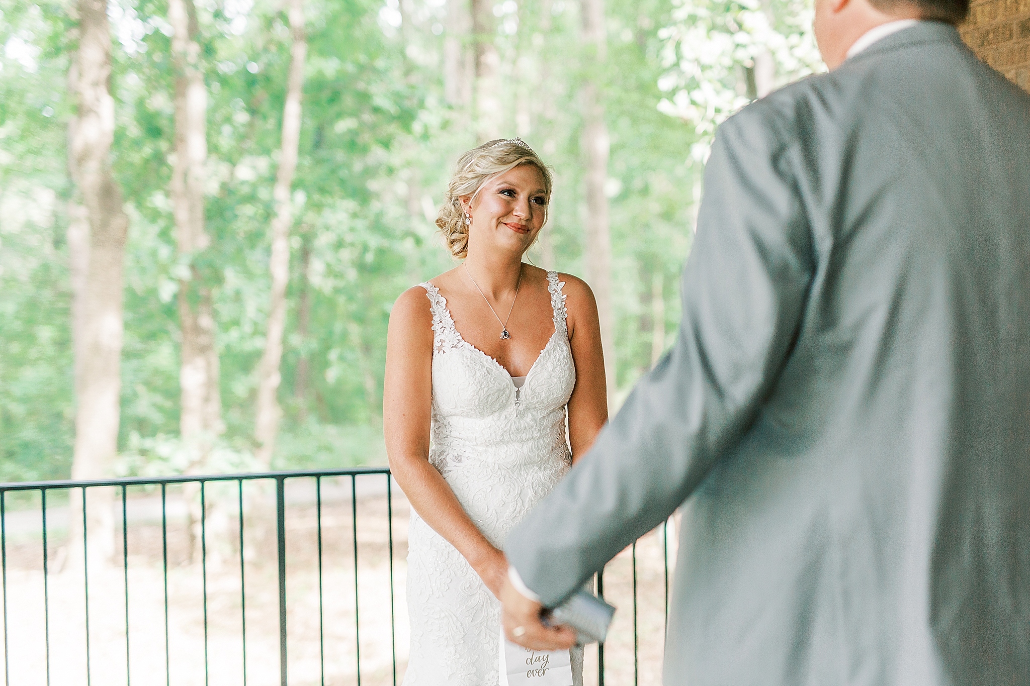 bride looks at dad during first look