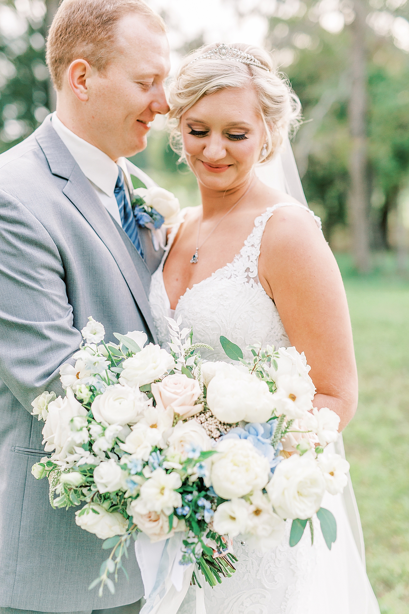 bride and groom pose together on Concord NC farm