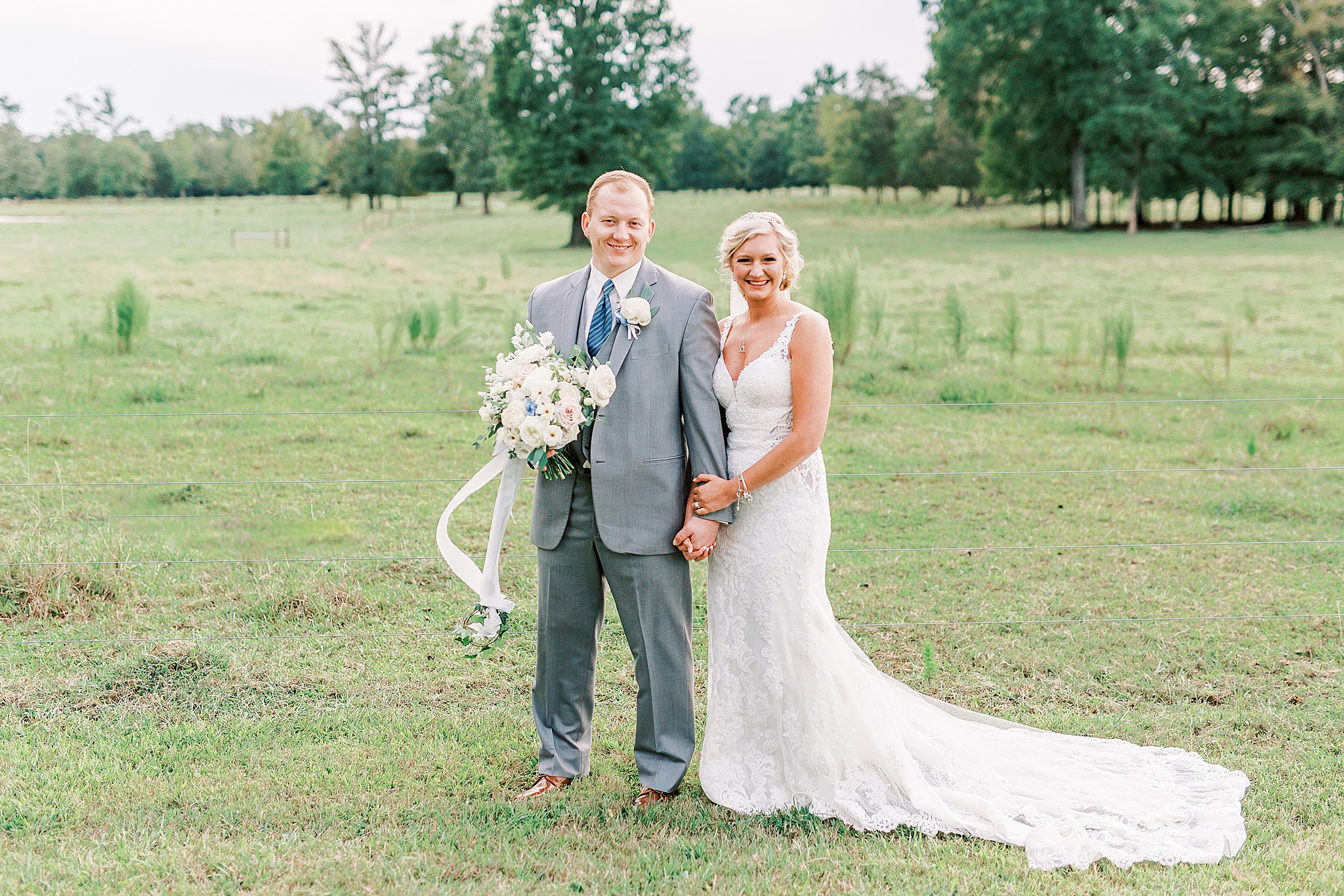 bride and groom stand together in field at The Farm at Brusharbor
