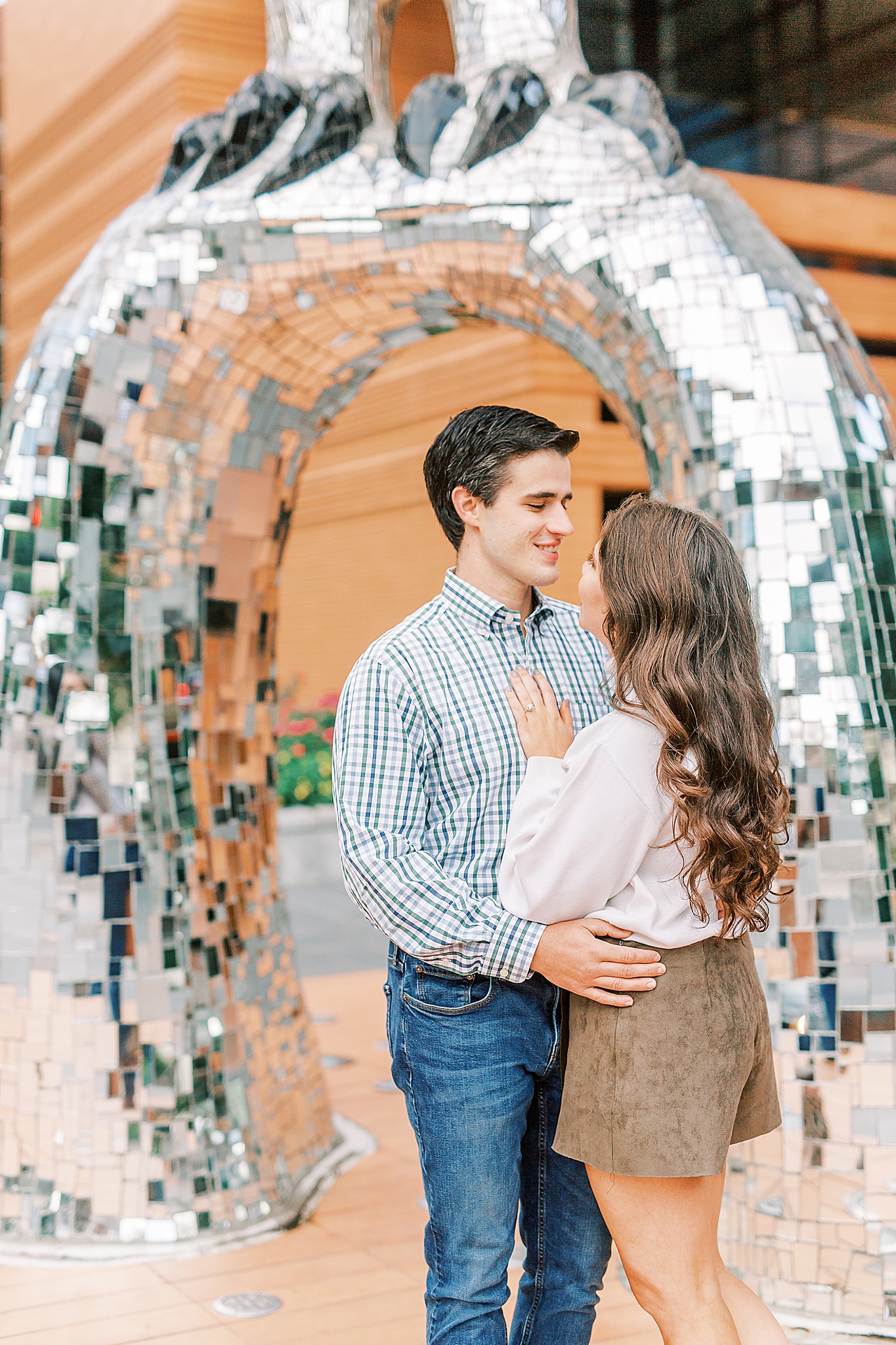 couple poses by Mint Museum in Charlotte NC