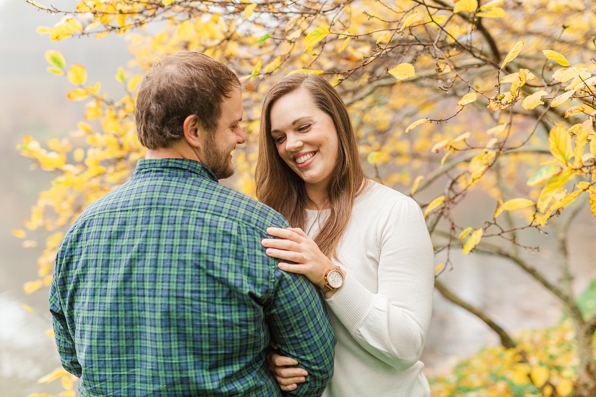 bride laughs during engagement photos