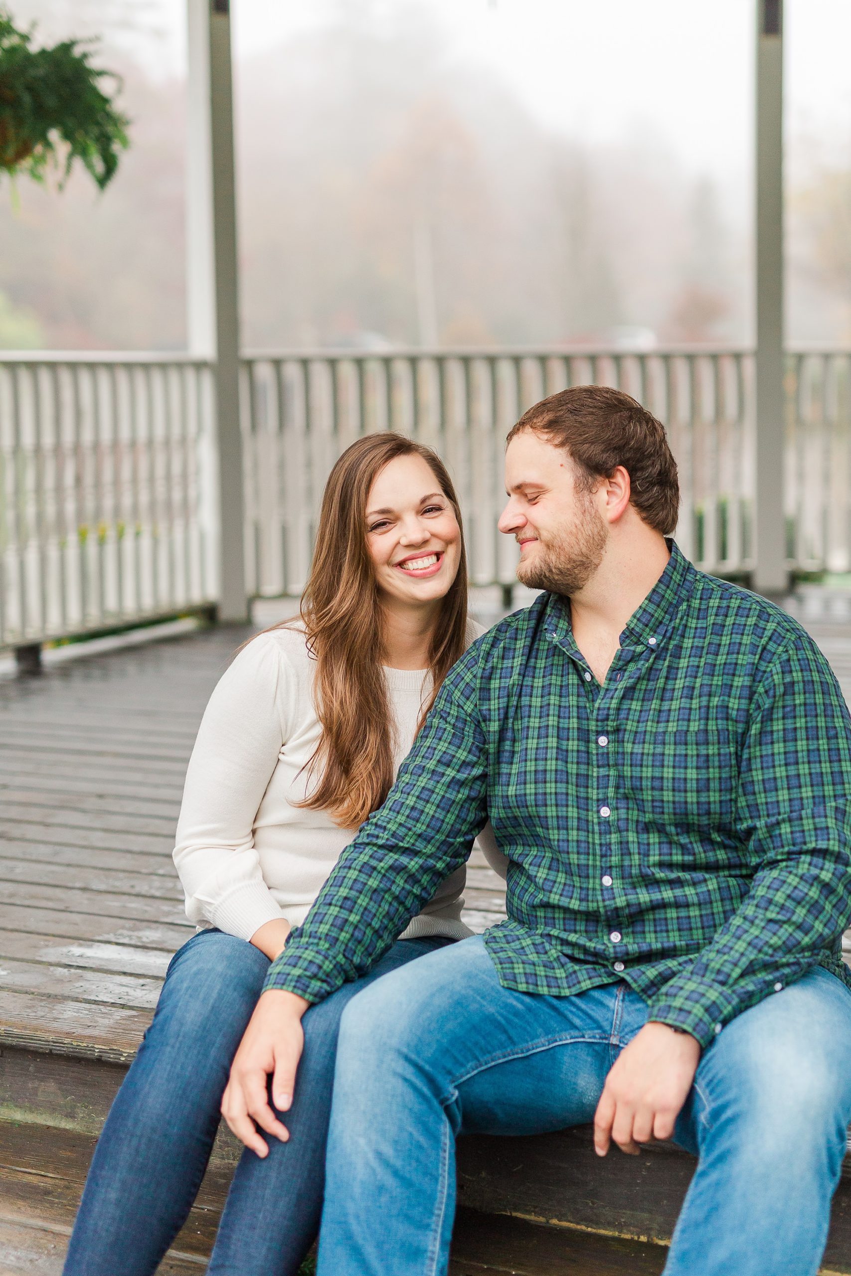 bride and groom sit on steps of gazebo