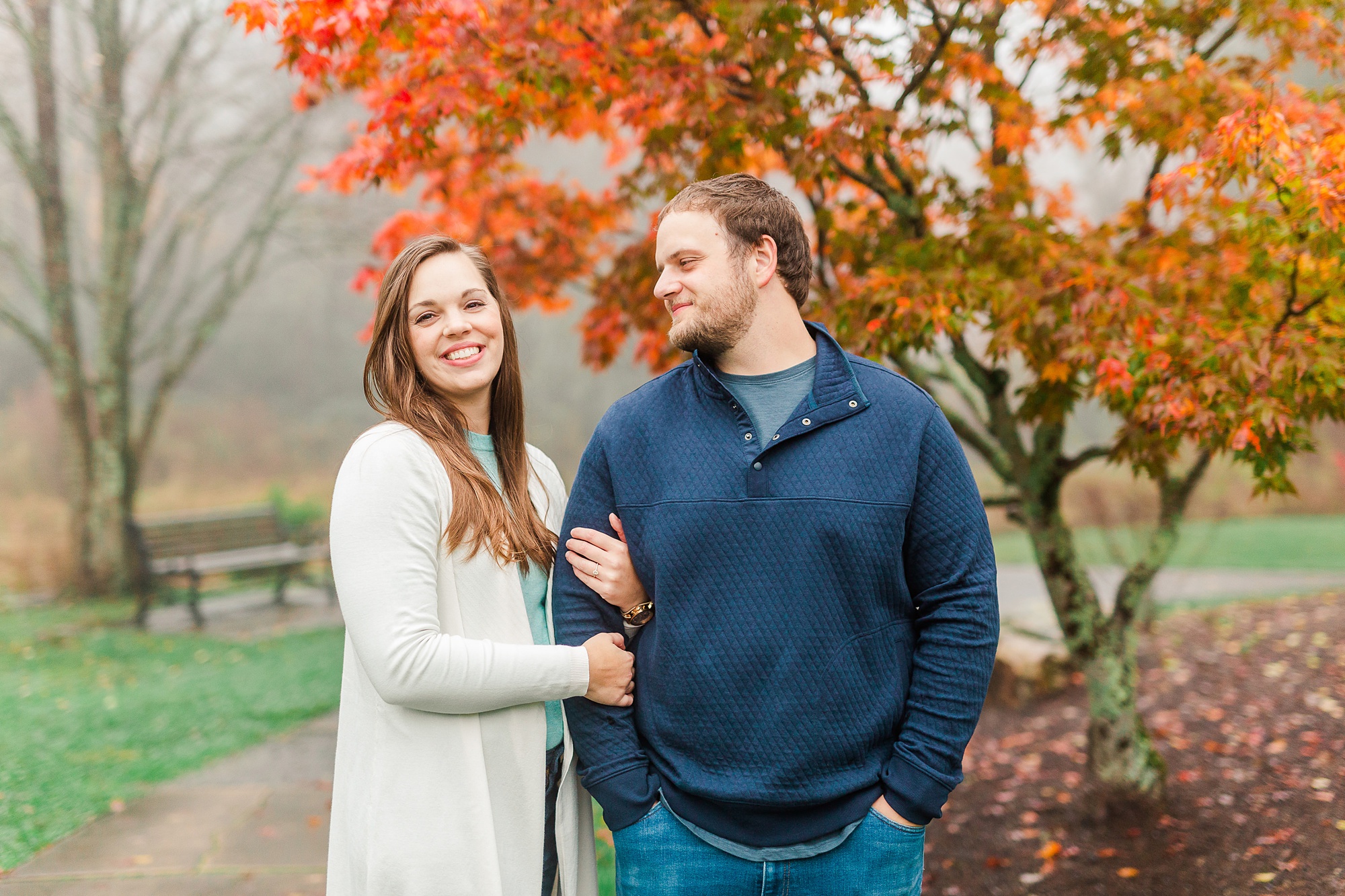groom looks at bride during engagement session