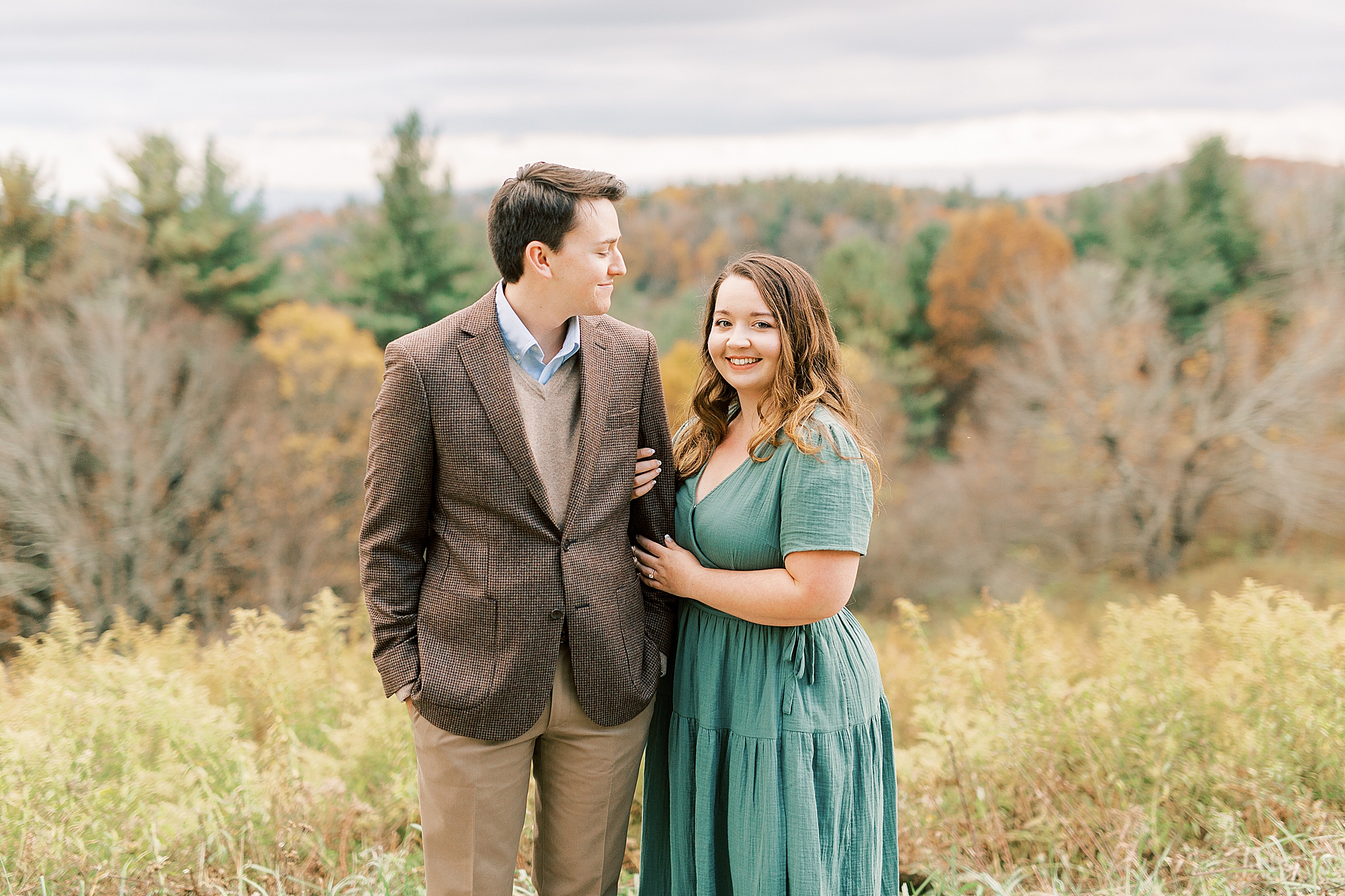 couple poses on grounds of Moses Cone Manor