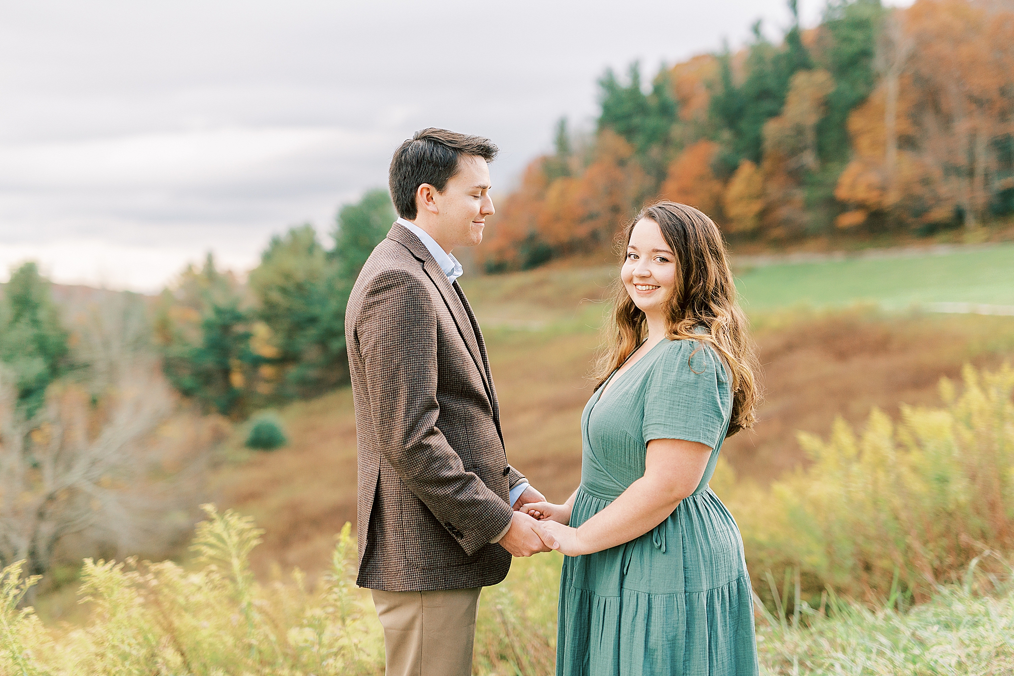 groom looks at bride during engagement photos in NC