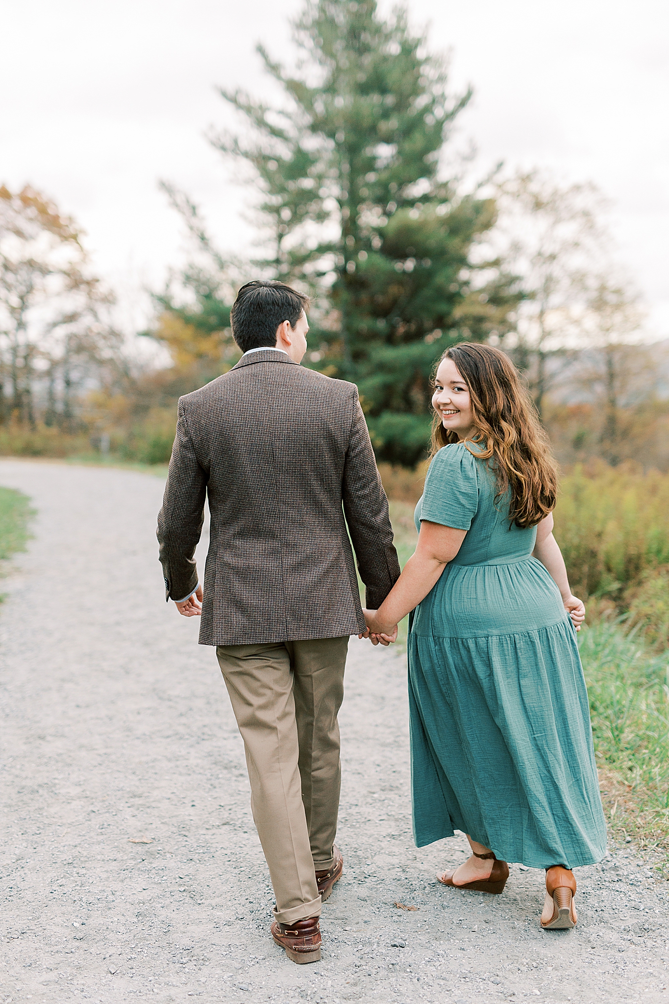 couple walks along driveway at Moses Cone Manor