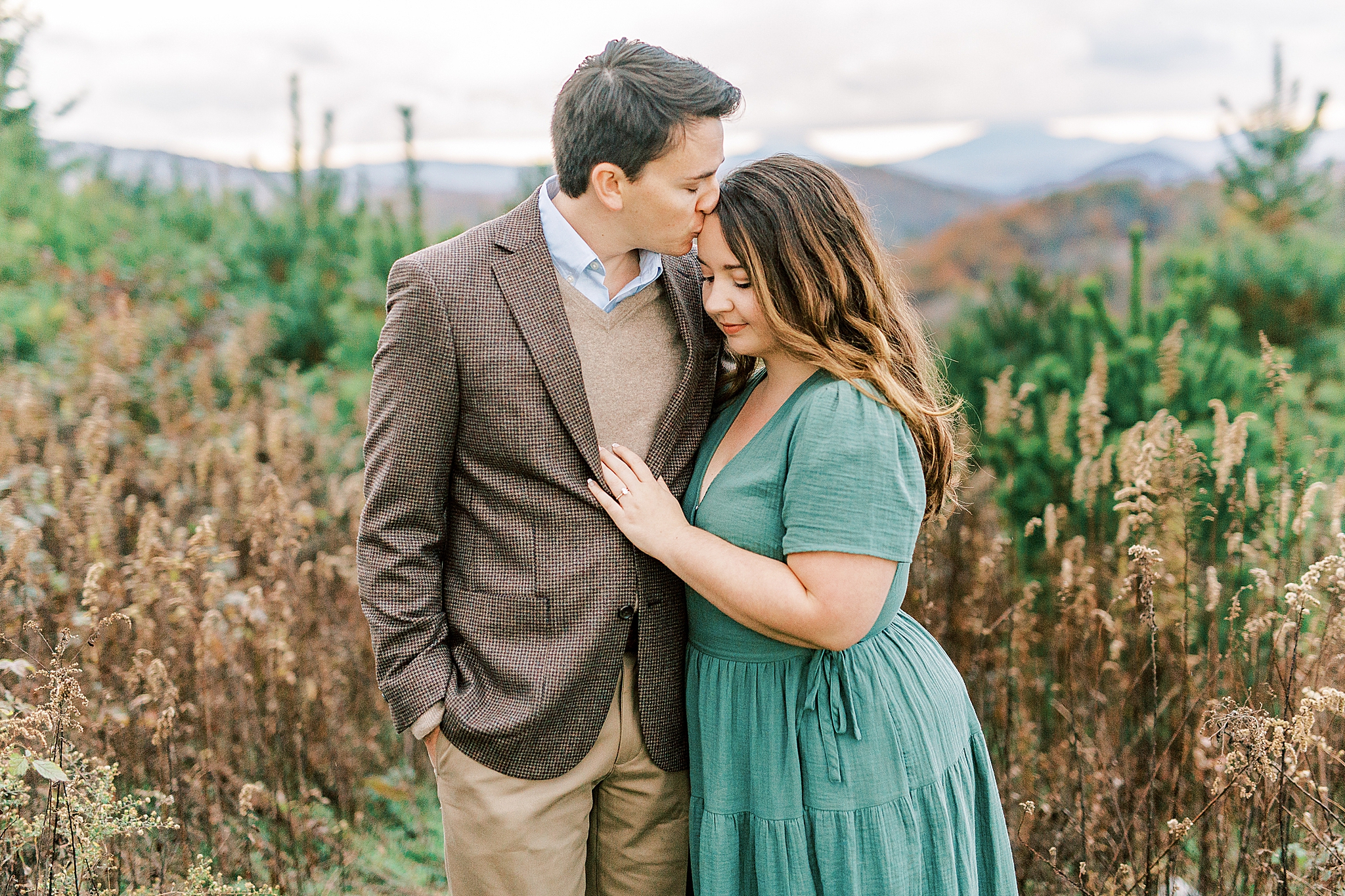 bride and groom cuddle during NC engagement photos