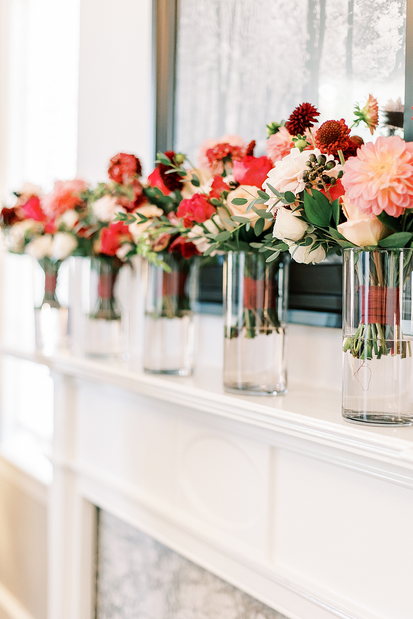 bride and bridesmaid bouquets on mantle at Separk Mansion