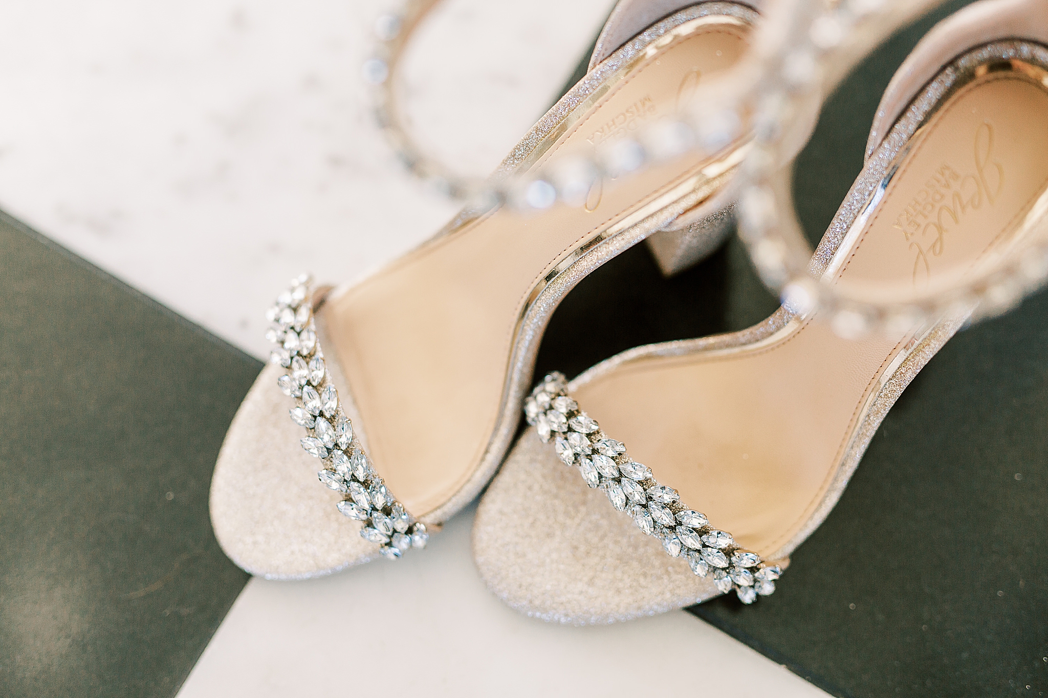 bride's shoes rest on black and white floor at Separk Mansion