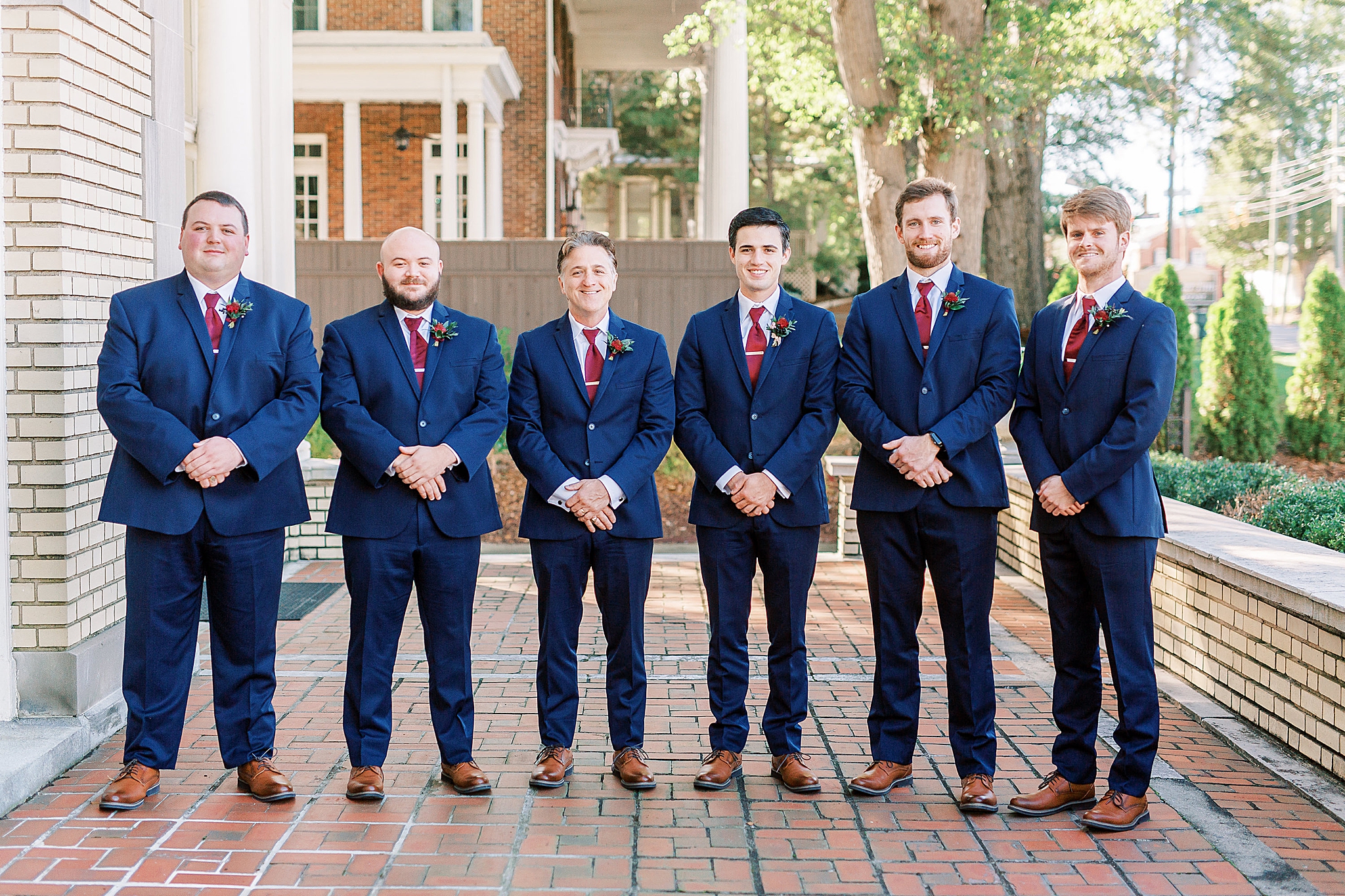 groomsmen pose on patio at Separk Mansion