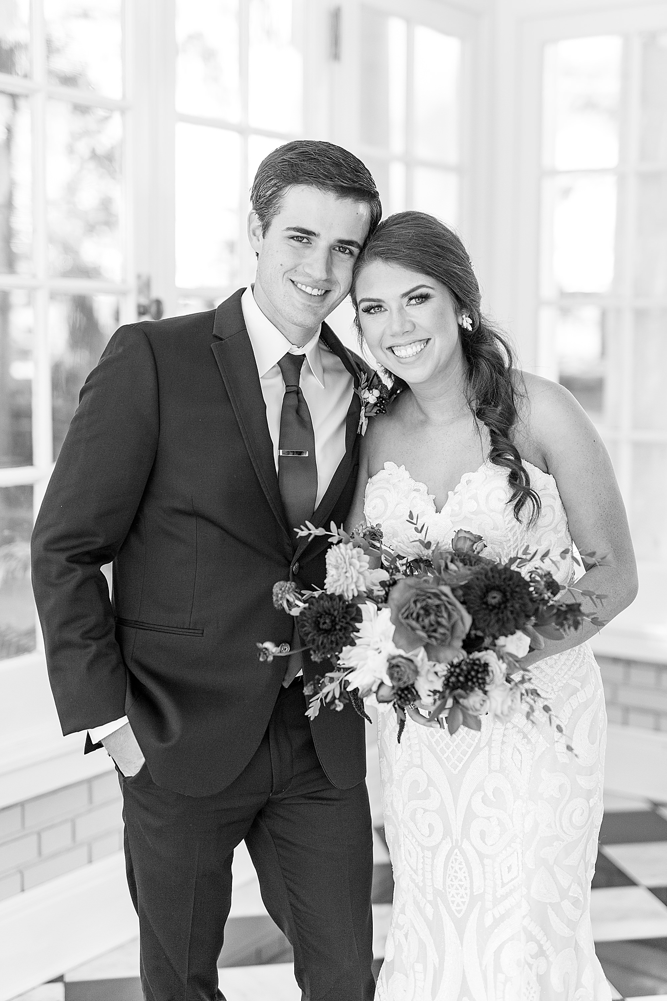 newlyweds pose inside Separk Mansion after first look