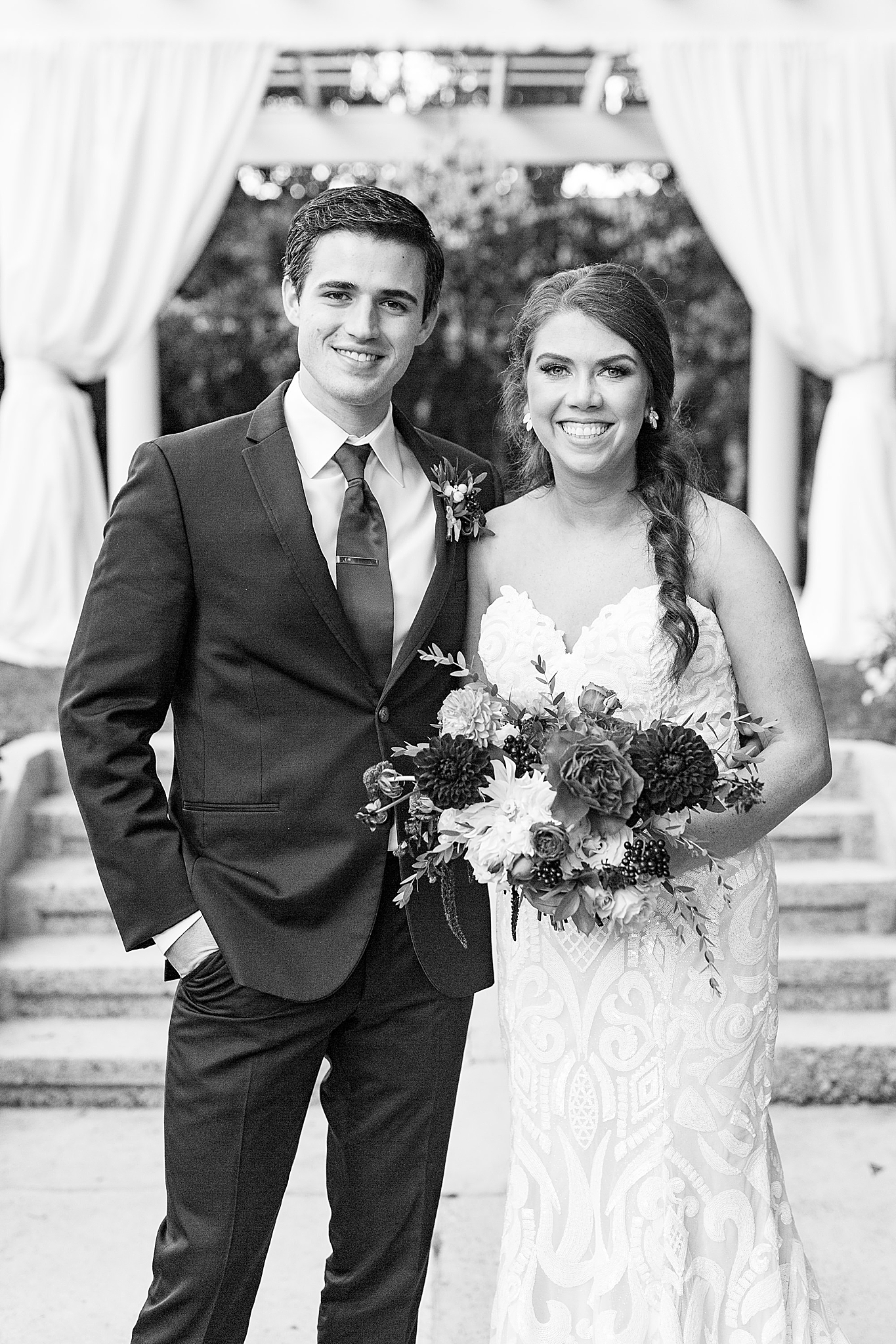 bride and groom pose in gardens of Separk Mansion