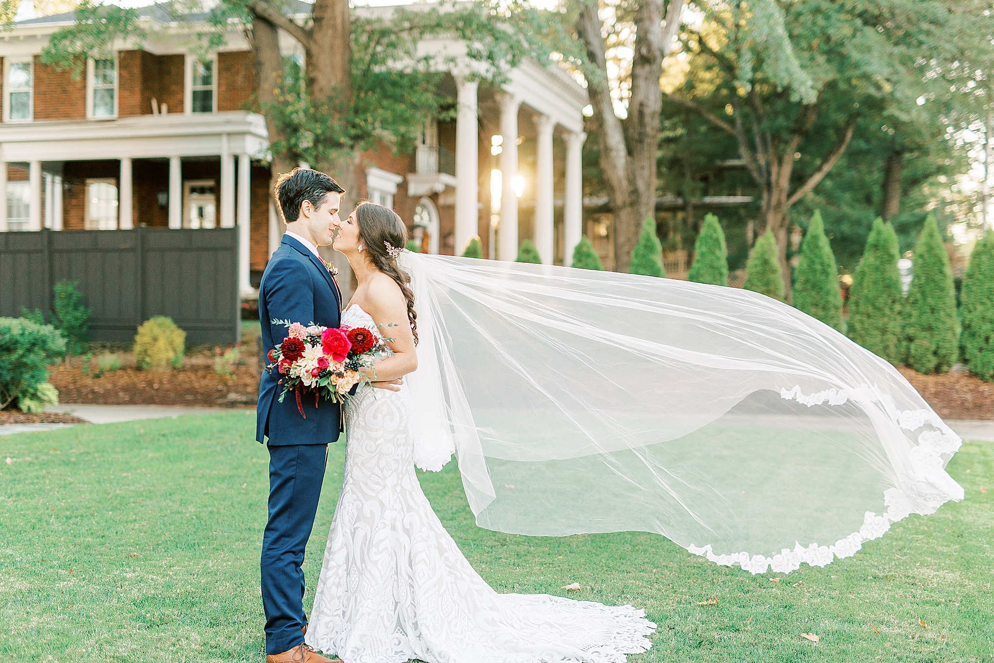 bride's veil floats during wedding portraits