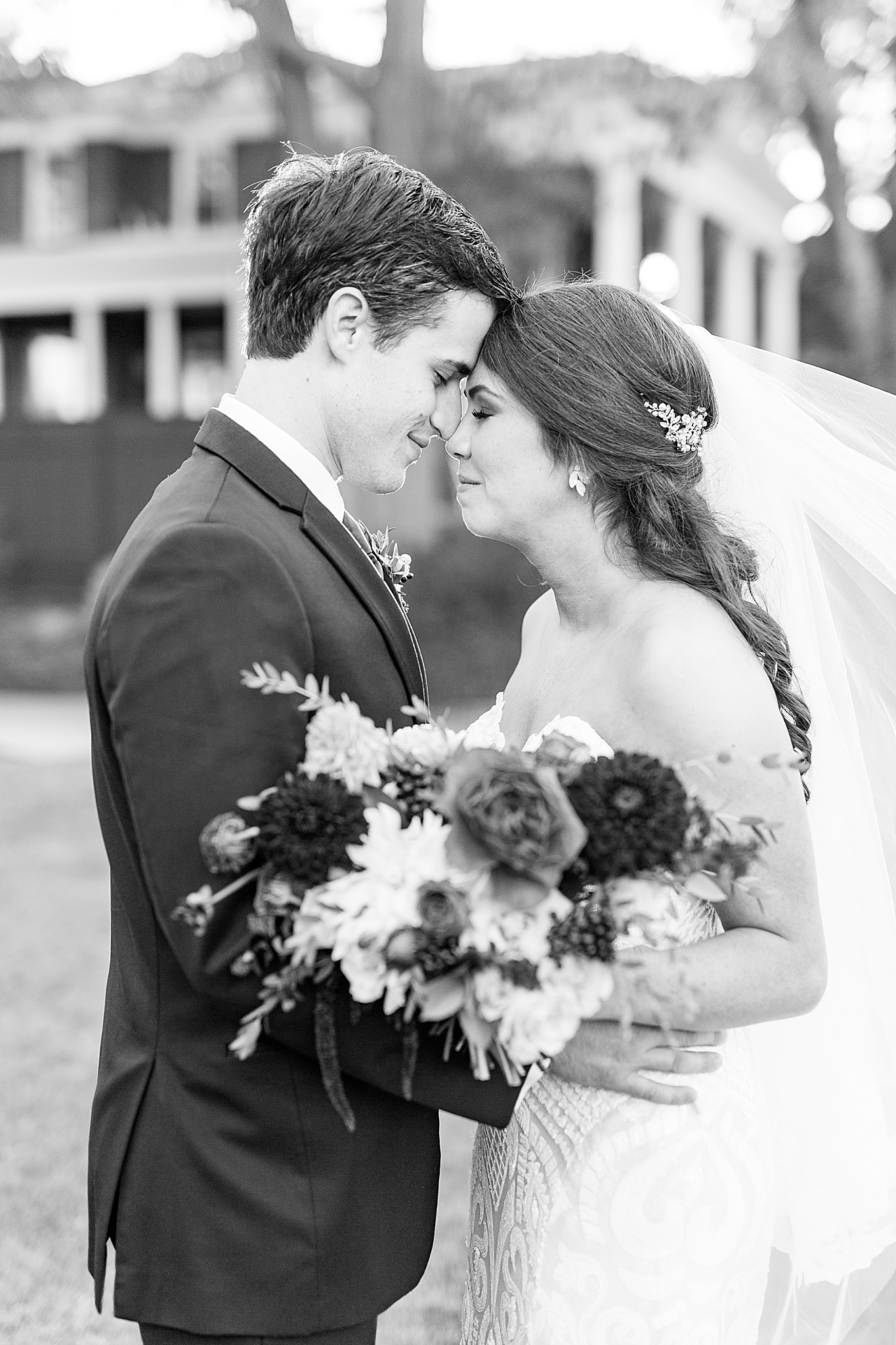 bride and groom pose together during Dinner Party Wedding portraits