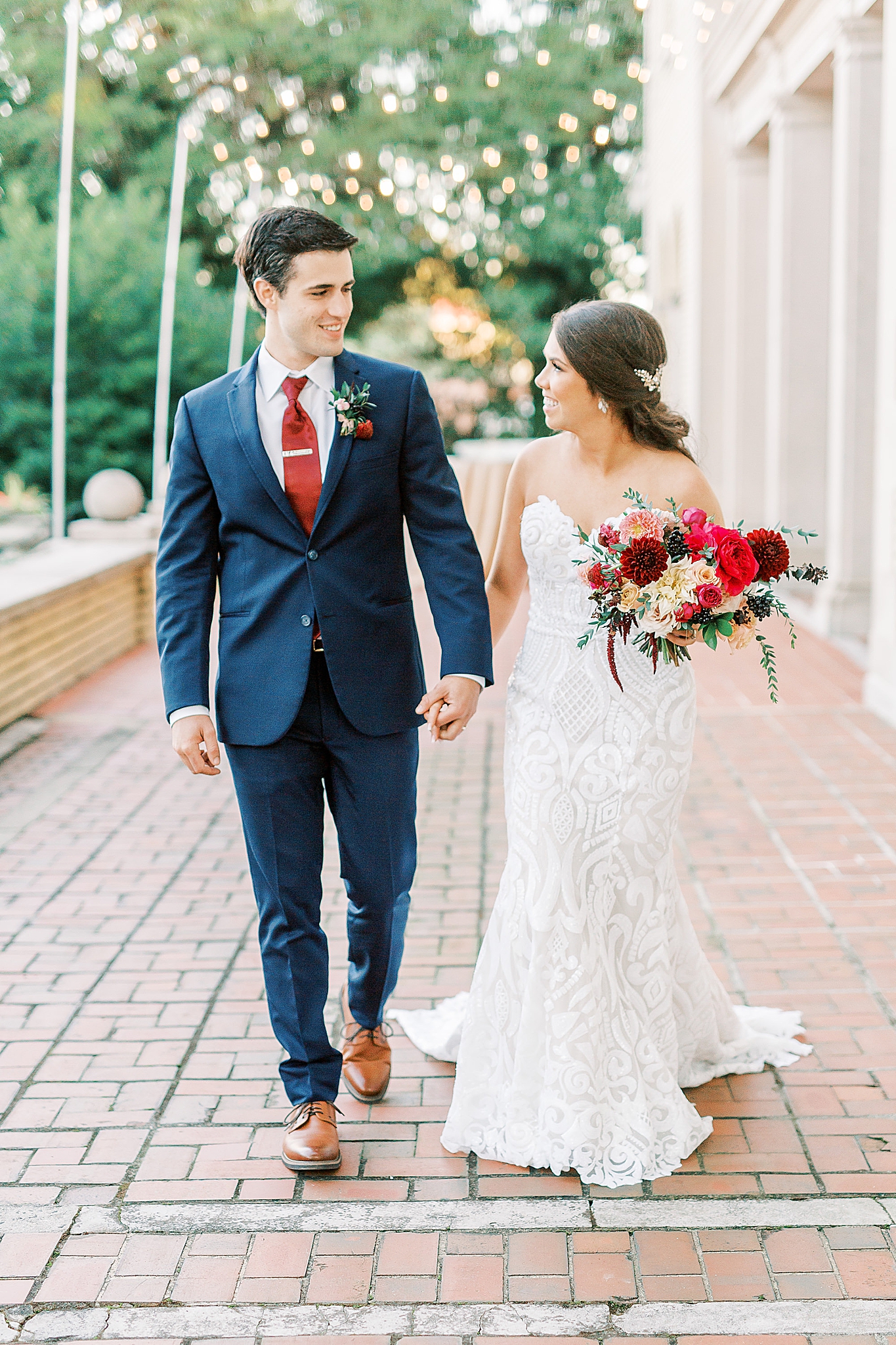 newlyweds walk through patio before Dinner Party Wedding