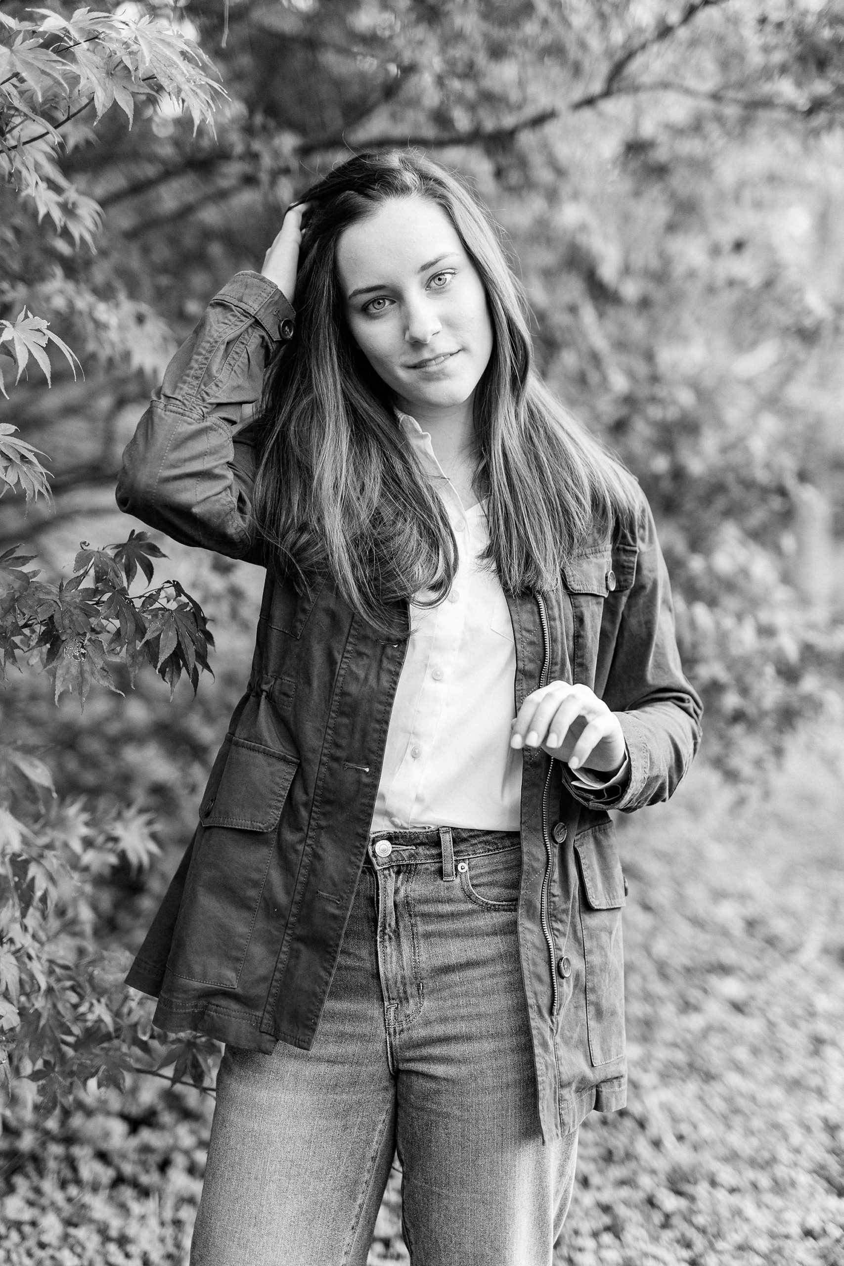 senior runs fingers through hair during Sloan Park senior photos