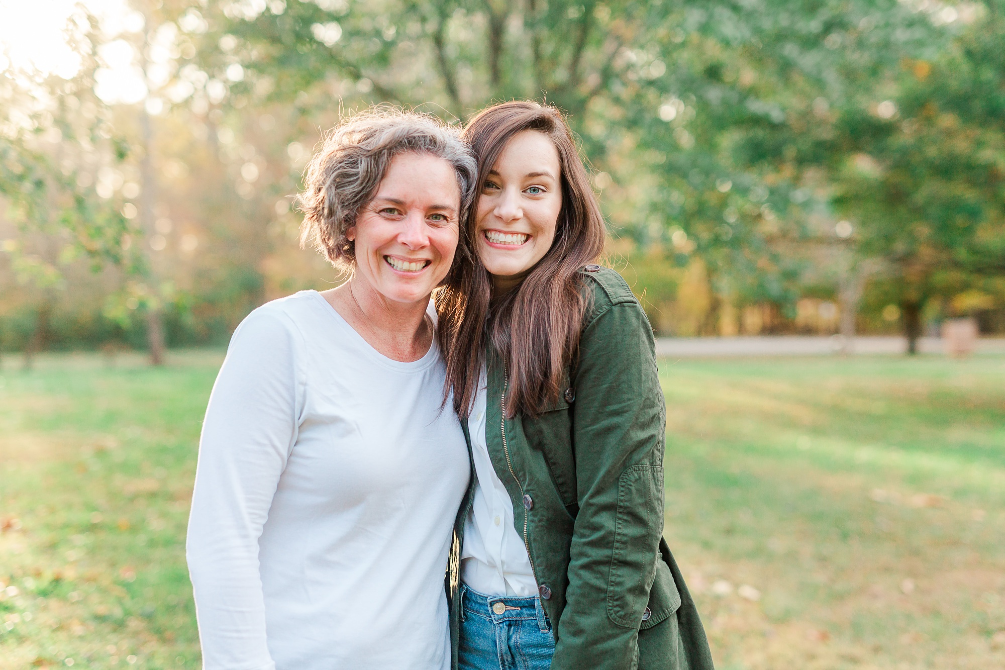 mom hugs daughter during senior portraits at Sloan Park