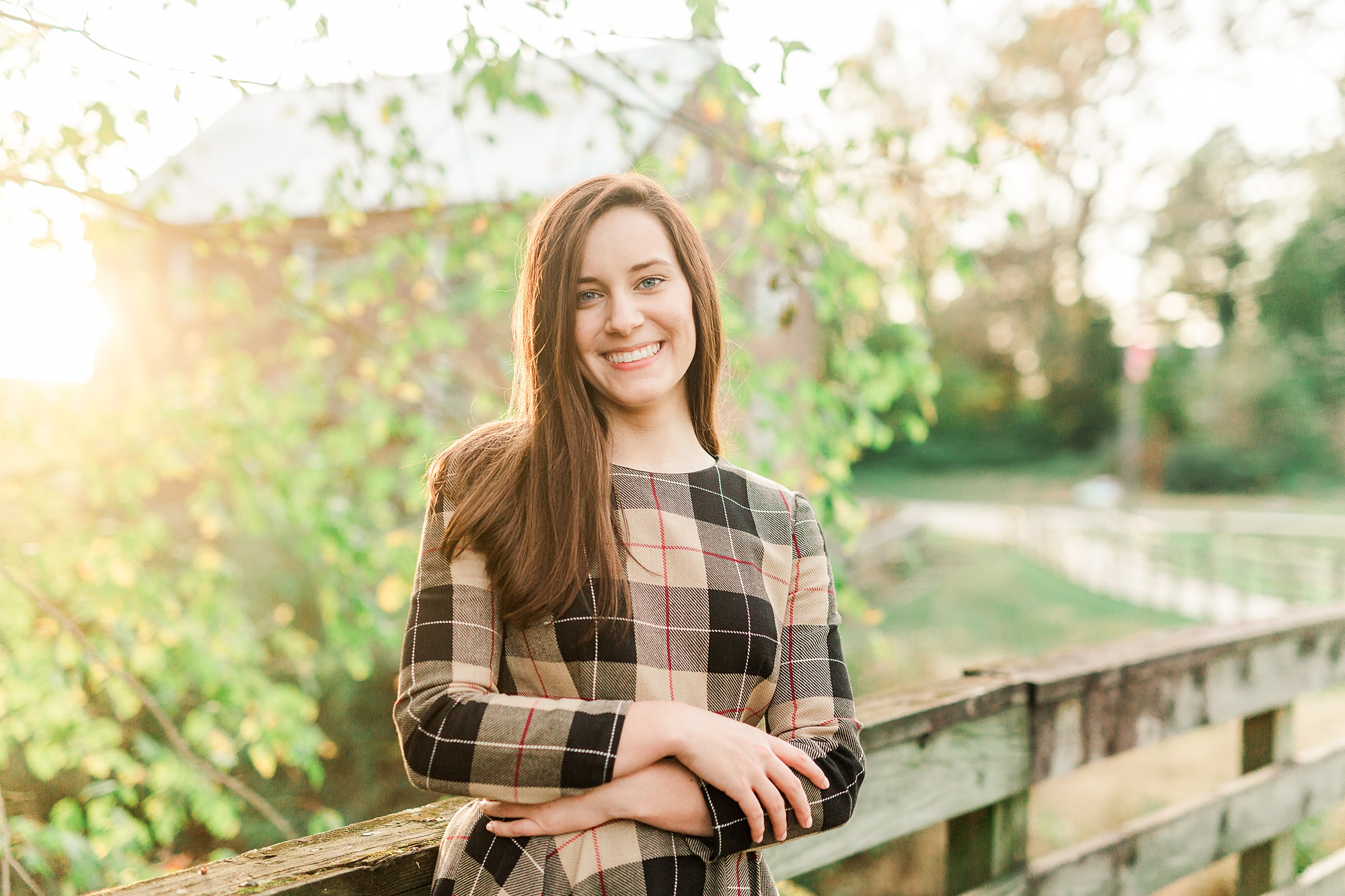 senior portraits at sunset on bridge in Sloan Park