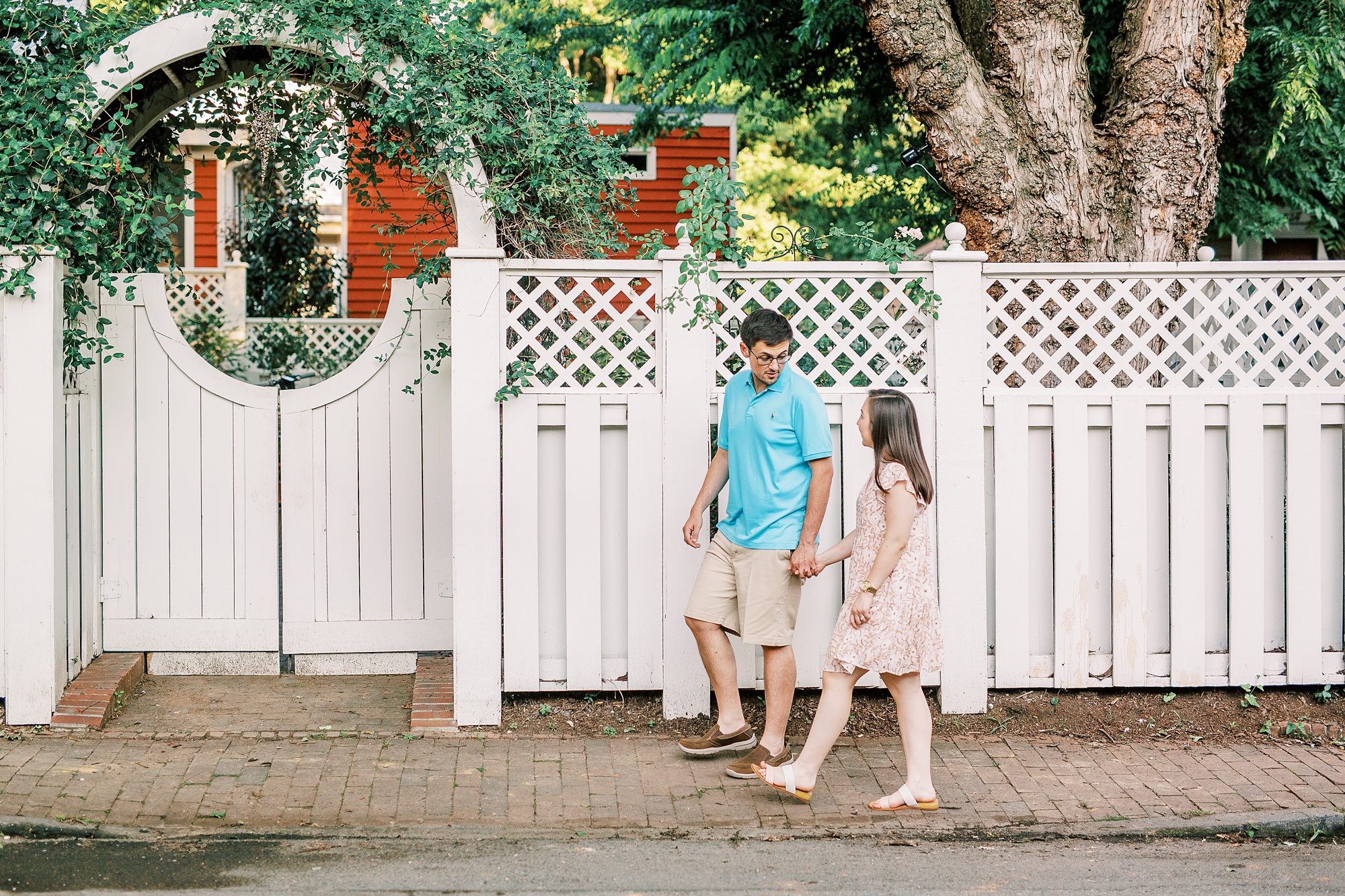 couple walks Charlotte NC sidewalk