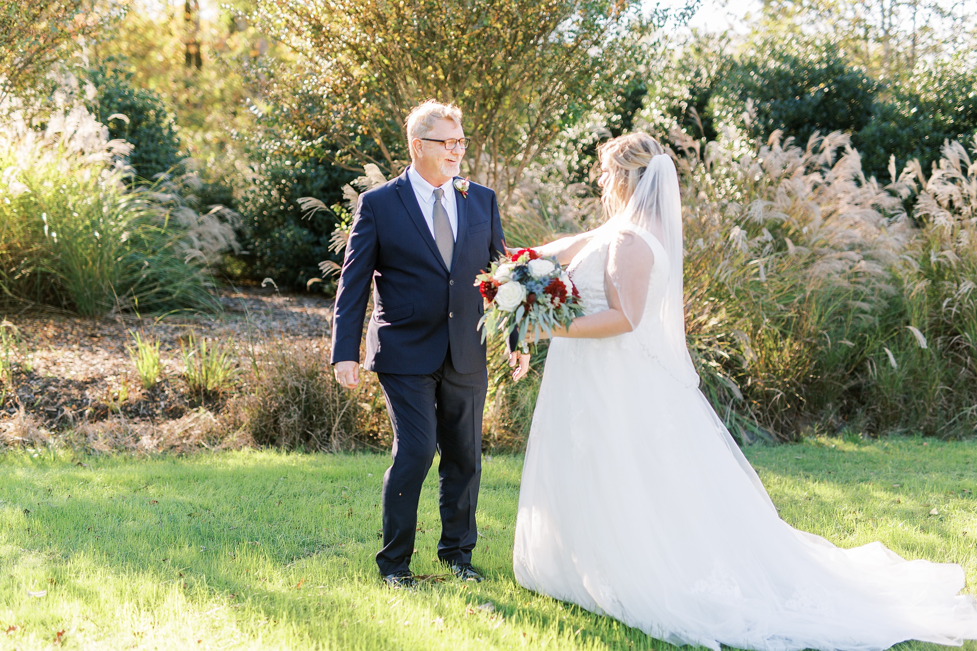 first look with dad and bride at Arbors Events