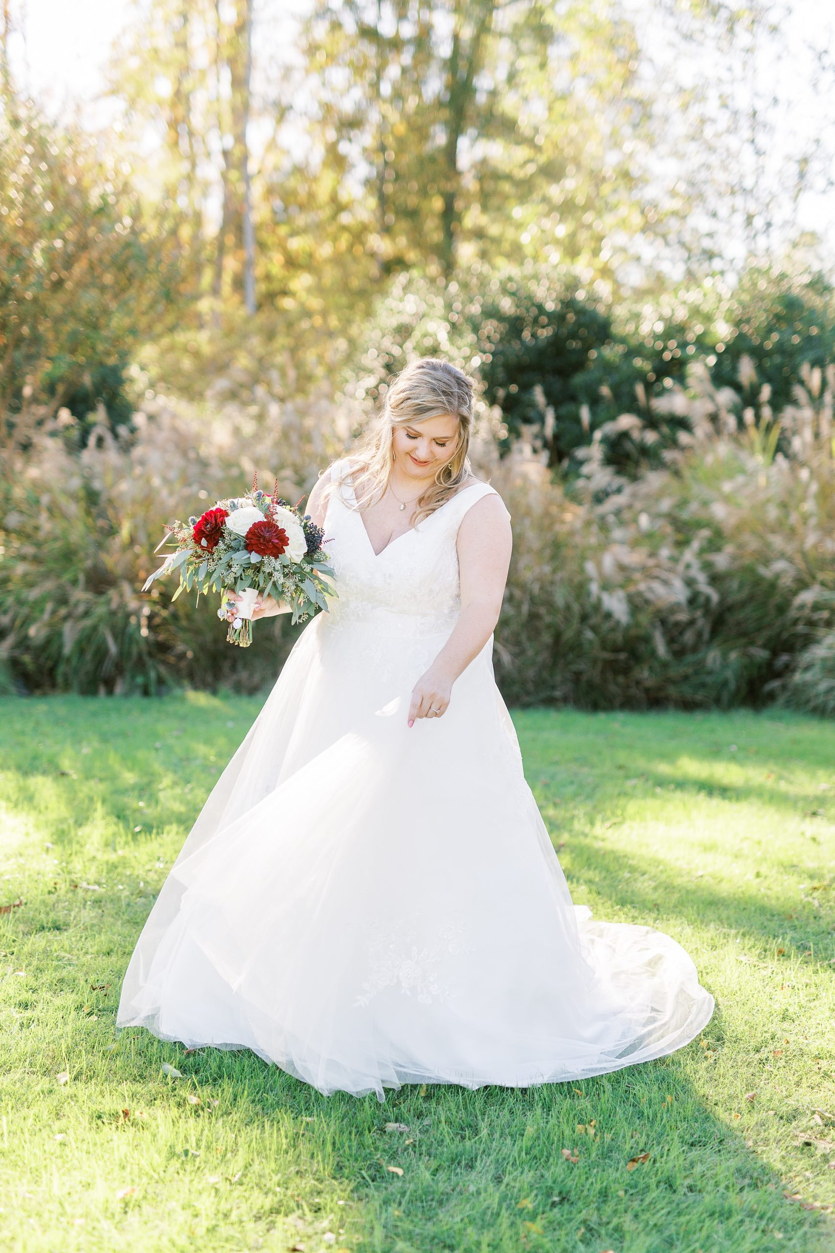 bride twirls wedding gown during NC wedding