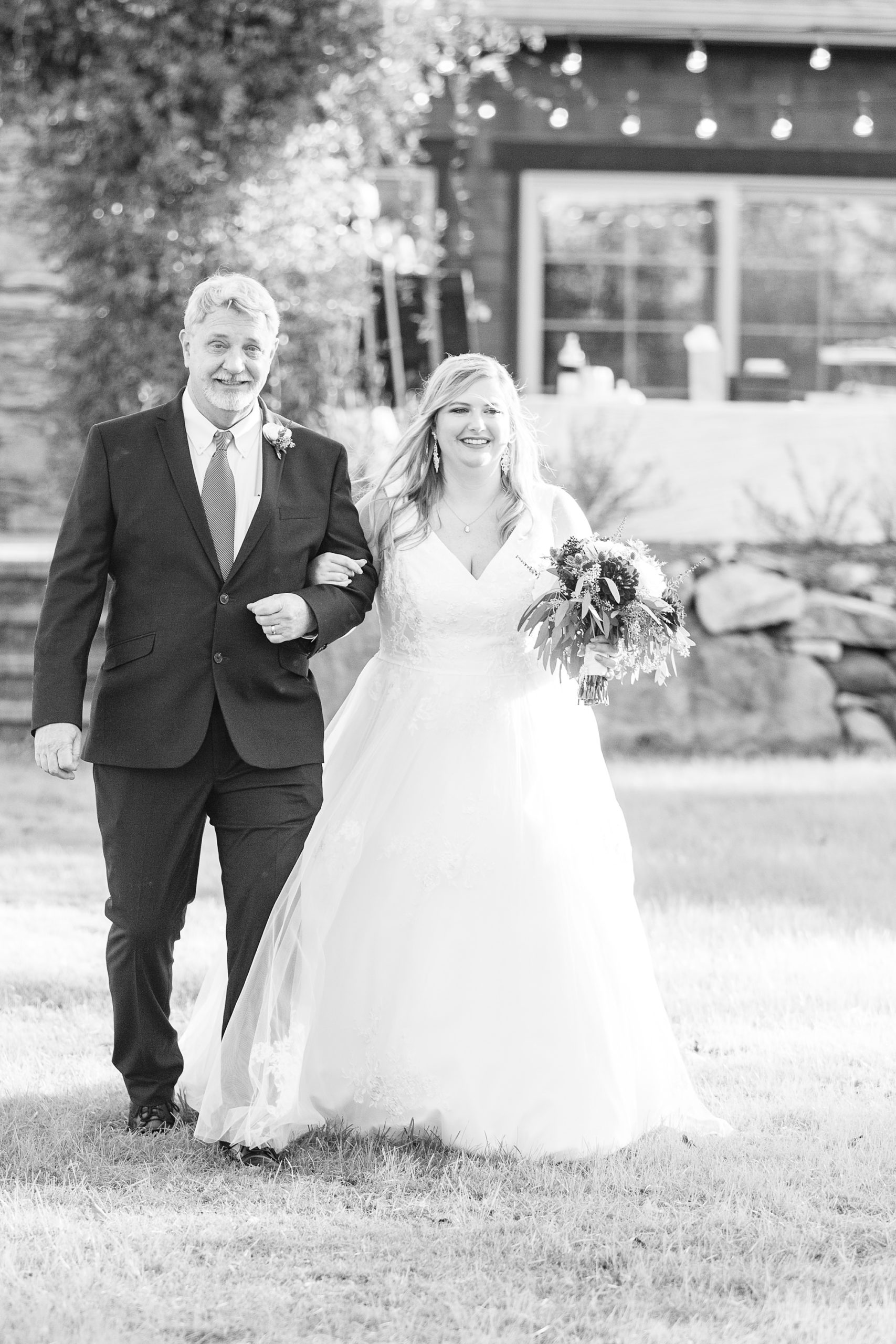 bride walks down aisle with father at Arbors Events wedding